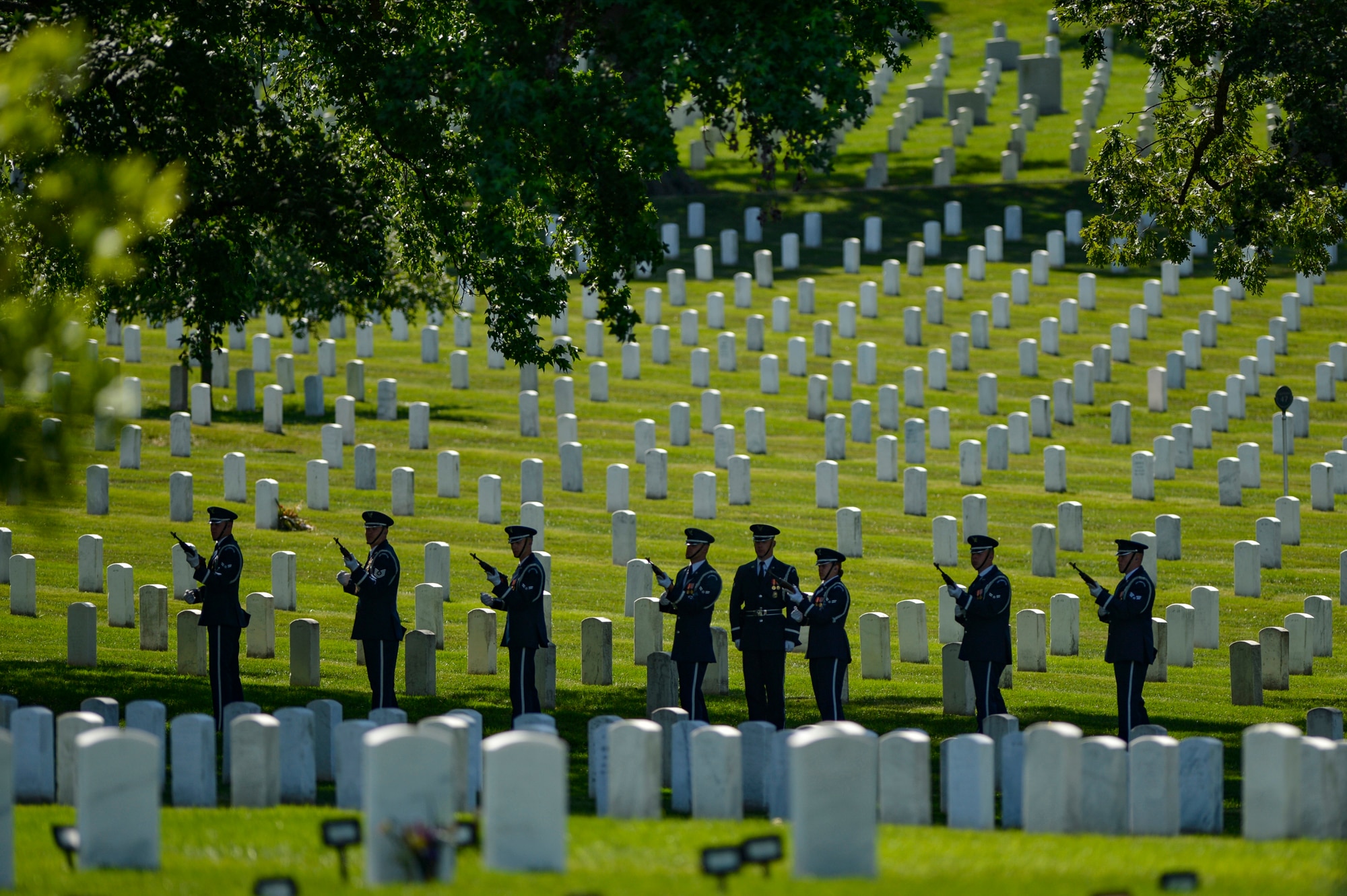 The U.S. Air Force Honor Guard performs a 21-gun salute during a graveside ceremony honoring former 2nd Lt. Malvin G. Whitfield, an Army Air Forces and Air Force veteran, at Arlington National Cemetery, Va., June 8, 2016. Whitfield joined the Army Air Forces in 1943 as a Tuskegee Airman, one of more than 1,000 African-American pilots who fought in World War II. (U.S. Air Force photo/Tech. Sgt. Joshua L. DeMotts)