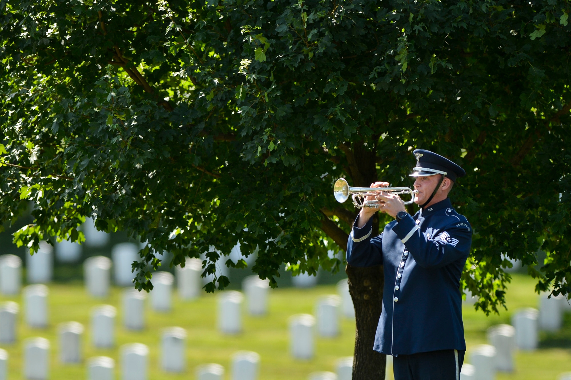 Tech. Sgt. Nathan Clark plays taps during a graveside ceremony honoring former 2nd Lt. Malvin G. Whitfield, an Army Air Forces and Air Force veteran, at Arlington National Cemetery, Va., June 8, 2016. In 1955, Whitfield was appointed by the educational exchange program in the Department of State to tour Europe, the Middle East and Africa as a sports goodwill ambassador. He died Nov. 19, 2015, at the age of 91. (U.S. Air Force photo/Tech. Sgt. Joshua L. DeMotts)