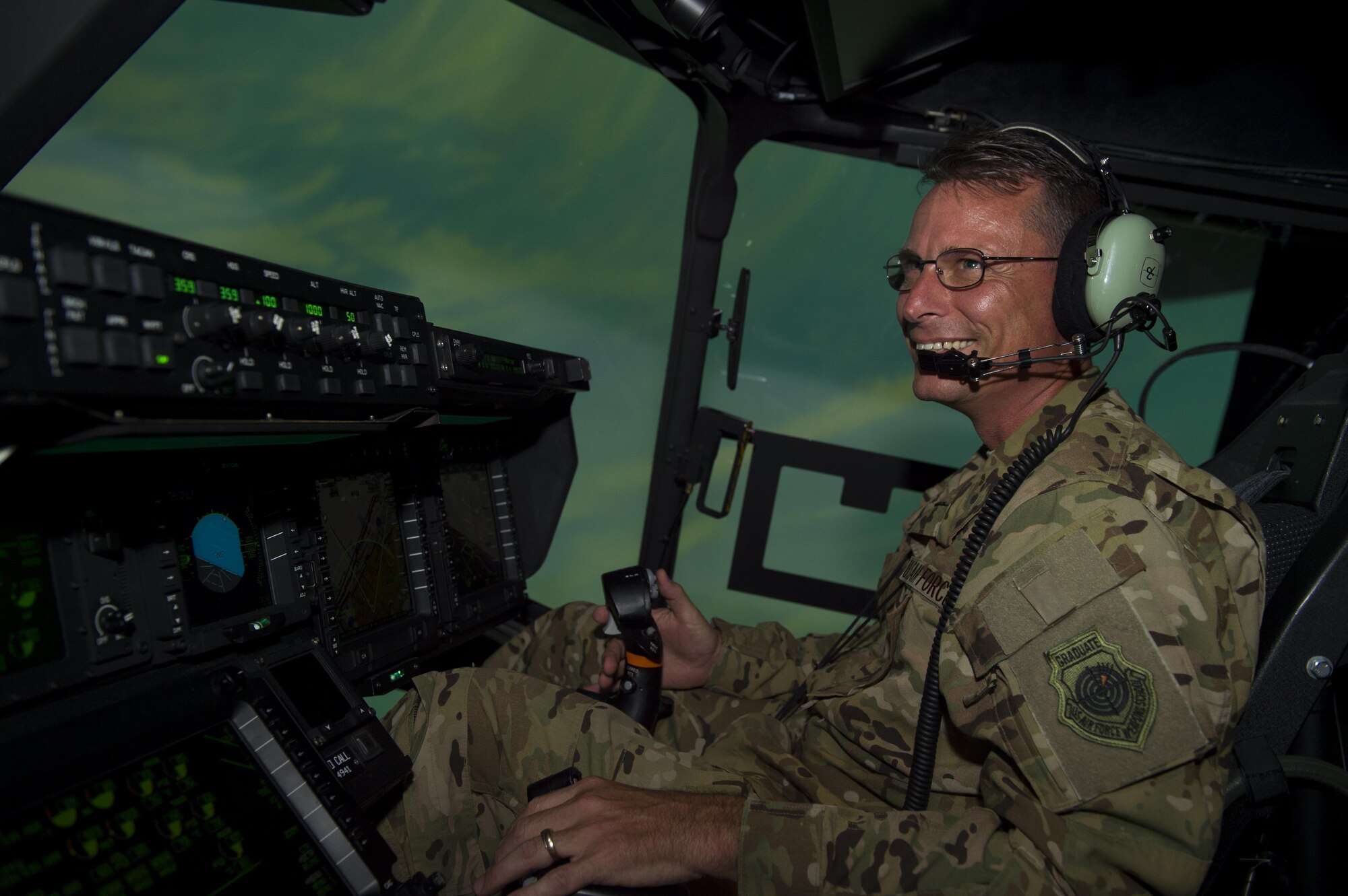 Col. Tom Palenske, vice commander of the 1st Special Operations Wing, completes a check ride in a CV-22 Osprey training simulator at Hurlburt Field, Fla., June 8, 2016. Palenske took command of the 1st SOW during a change of command ceremony here, June 10, 2016. (U.S. Air Force Photo by Airman 1st Class Kai White)
