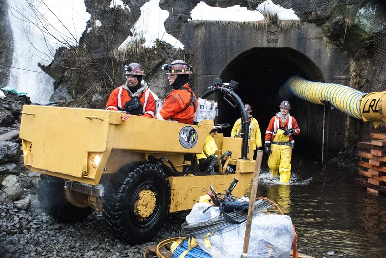 Construction workers exit the Mount St. Helens' Spirit Lake Output Tunnel Jan. 11, 2016. The U.S. Forest Service, who owns the tunnel, the U.S. Army Corps of Engineers and other local and state partners are completing interim repairs to the tunnel with an expected completion by the end of February. 