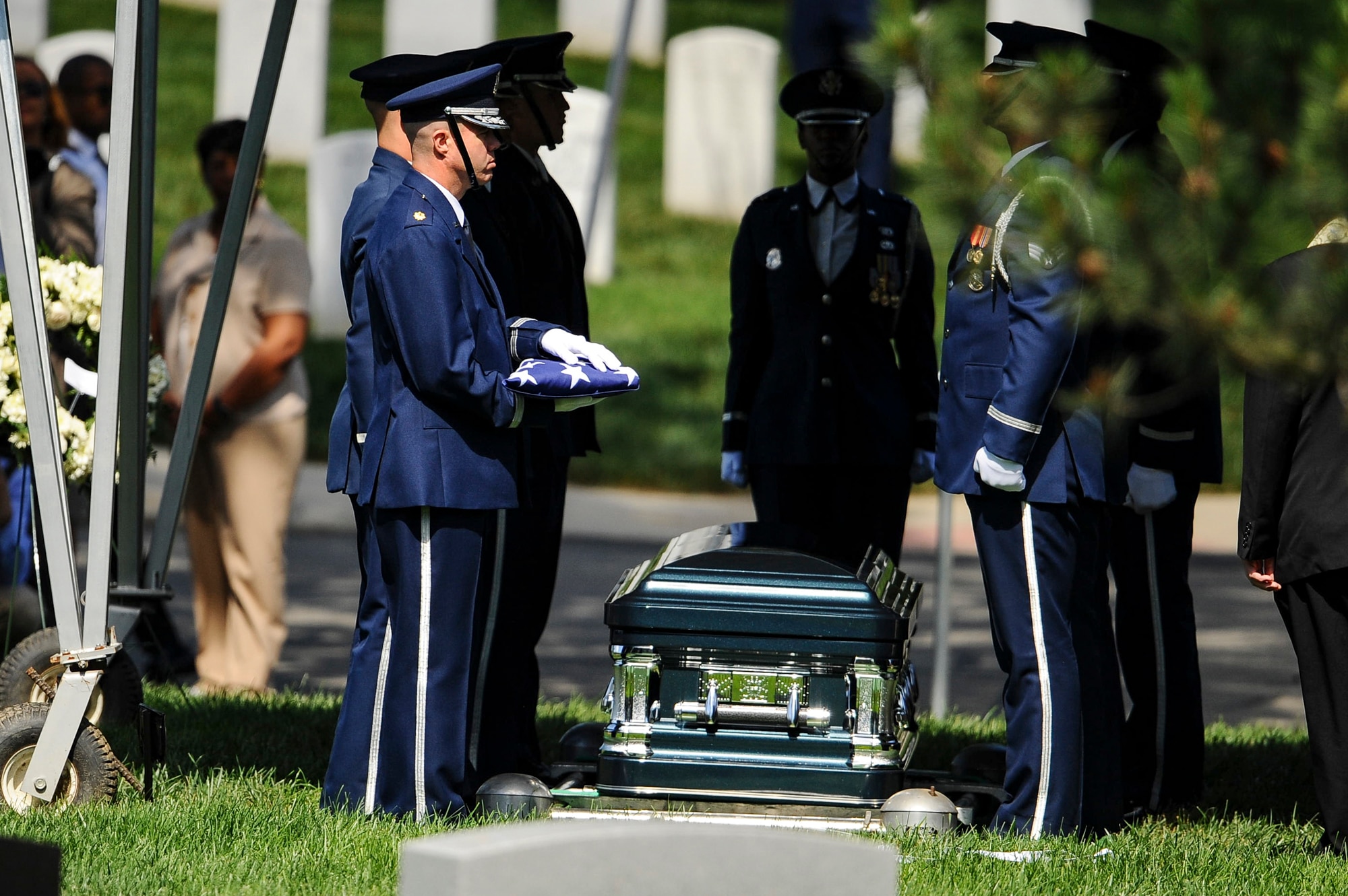 Chaplain (Maj.) Kevin Hudson conducts the final inspection of former 2nd Lt. Malvin G. Whitfield’s flag before presenting it to his wife, Nola, at a graveside ceremony at Arlington National Cemetery, Va., June 8, 2016. Whitfield died Nov. 19, 2015, at the age of 91. (U.S. Air Force photo/Tech. Sgt. Bryan Franks)