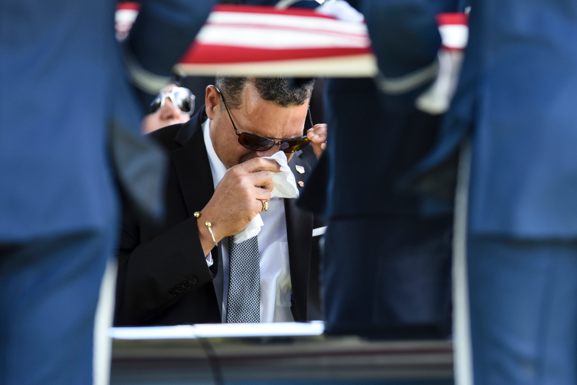 Malvin Whitfield, the son of former 2nd Lt. Malvin G. Whitfield, wipes a tear from his eye during his father’s graveside ceremony at Arlington National Cemetery, Va., June 8, 2016. In 1943, Whitfield enlisted in the Army Air Forces as a Tuskegee Airman. The Tuskegee Airmen are those who joined the Army Air Forces or served as civilian support staff in the “Tuskegee Experience” from 1938 to 1946. (U.S. Air Force photo/Tech. Sgt. Anthony Nelson Jr.)