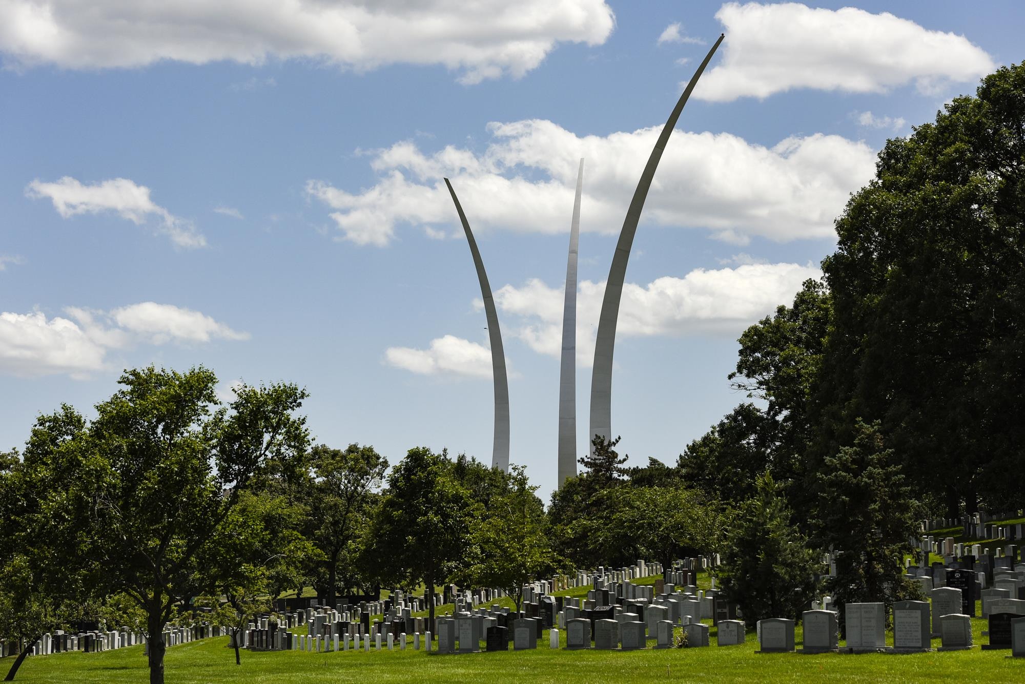 The Air Force Memorial is seen in the background as former 2nd Lt. Malvin G. Whitfield, 91, was laid to rest at Arlington National Cemetery, Va., June 8, 2016. In 1943, Whitfield enlisted in the Army Air Forces as a Tuskegee Airman, and later joined the Air Force Reserve as an officer. He died Nov. 19, 2015, at the age of 91. (U.S. Air Force photo/Staff Sgt. Alyssa C. Gibson)