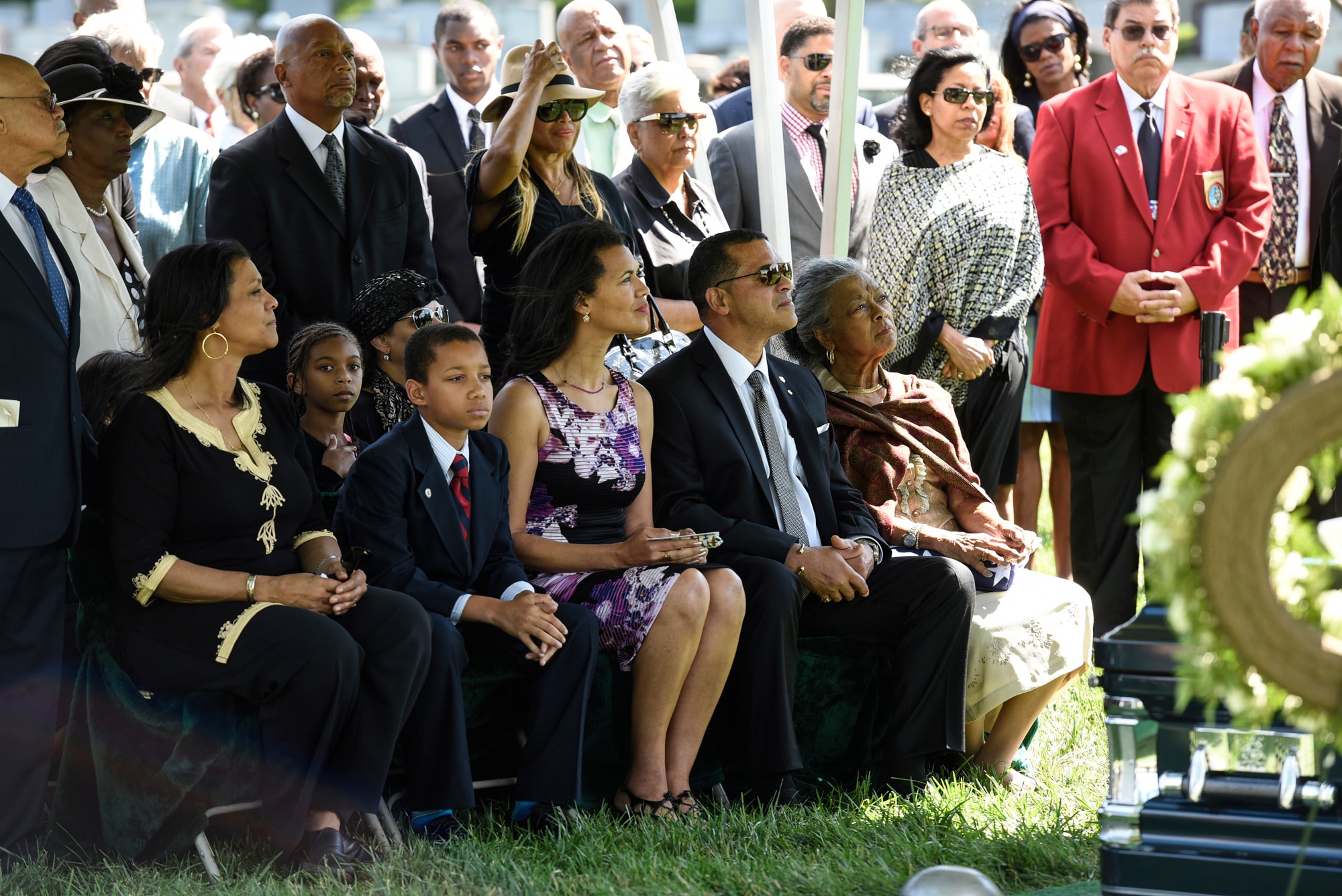 Former 2nd Lt. Malvin G. Whitfield’s family and friends attended his graveside service at Arlington National Cemetery, Va., June 8, 2016. Whitfield served in the Army Air Forces as a Tuskegee Airman during World War II and then in the Air Force during the Korean War. He is survived by his daughters Nyna Konishi and Fredricka Whitfield, son Malvin Whitfield Jr., and wife Nola Whitfield. (U.S. Air Force photo/Staff Sgt. Alyssa C. Gibson)