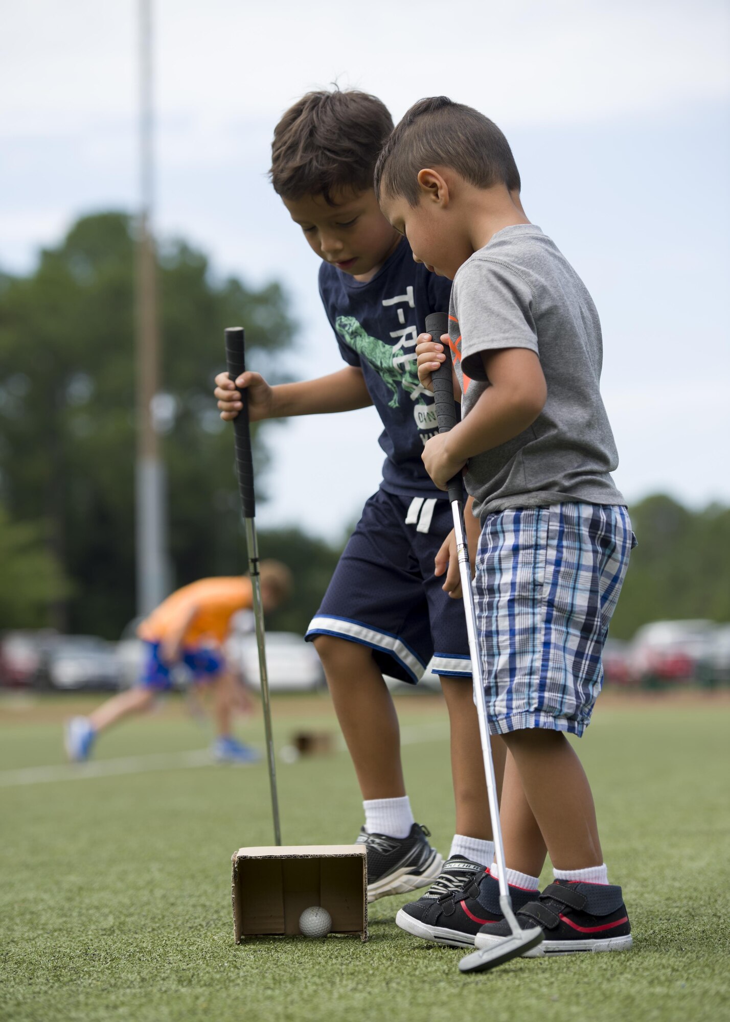 Children putt during the library’s Summer Reading Program kickoff at Hurlburt Field, Fla., June 9, 2016. The opening ceremony was Olympics-themed and centered on physical and mental challenges to teach children about the importance of working hard and setting goals. The summer Olympics-theme was titled ‘Read for the Win!’ and encouraged children to train like Olympians to overcome their challenges in life. (U.S. Air Force photo by Airman 1st Class Kai White)
