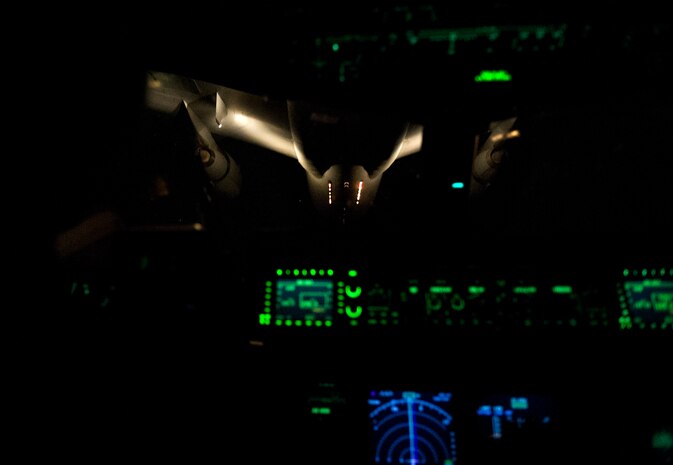 A KC-10 Extender gets into position to provide an aerial refueling to a C-17 Globemaster  III during Exercise Swift Response June 7, 2016. Aircraft from across Air Mobility Command provided airlift and in-flight refueling capabilities for the exercise. In addition to participating in Exercise Swift Response, AMC air crews tested the capability of refueling a C-17 formation using a mix of tankers. Until this test, different types of tankers had never been used together because of the difference in air speed each one requires to perform a refueling. (U.S. Air Force photo/Staff Sgt. William A.
O'Brien)