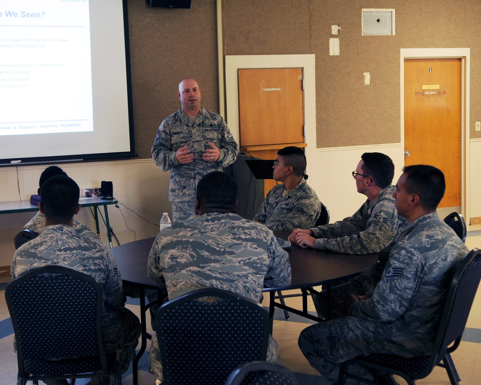 U.S. Air Force Chief Master Sgt. Aaron Bennett, 7th Bomb Wing command chief, speaks to Airmen during the first ever Fly-Flight-Win session May 25, 2016, at Dyess Air Force Base, Texas. The Fly-Flight-Win initiative is a new concept developed by members of the Dyess Integrated Delivery System to help strengthen the connection of Airmen to the Air Force and its heritage. It emphasizes the importance of Comprehensive Airman Fitness skills and social relationships, which help Airmen stay focused and resist negative influences. (U.S. Air Force photo by Senior Airman Kedesha Pennant/Released)