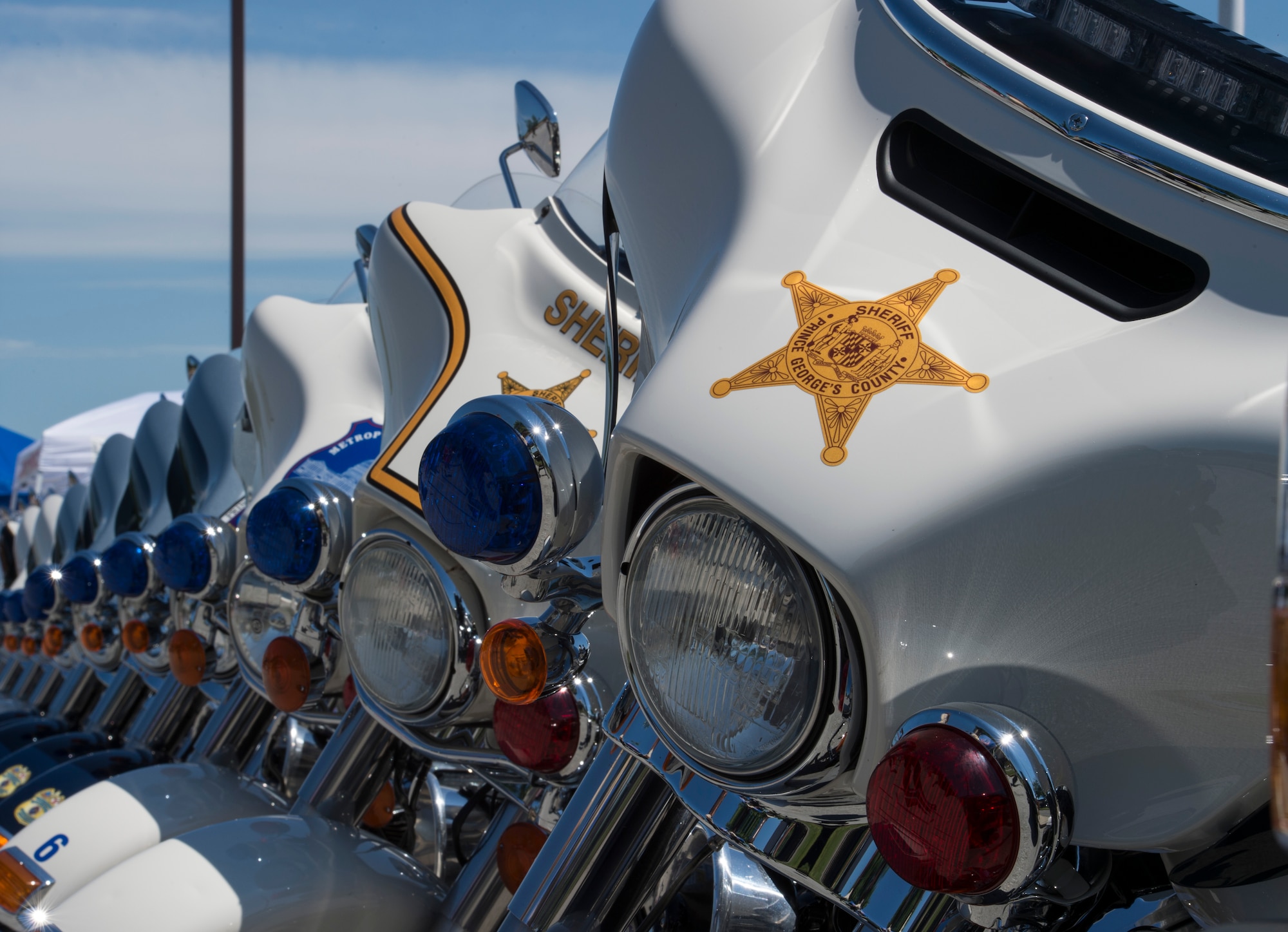 Police motorcycles are parked after a group ride during Motorcycle Safety Day on Joint Base Andrews, Md., June 9, 2016. The day included vendors, local clubs, food, demonstrations, riding groups, prize giveaways and an escorted group ride led by local law enforcement officers. (U.S. Air Force photo by Senior Airman Ryan J. Sonnier/RELEASED)