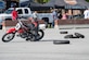 Mikayla Moore, Willpower Motorcycle Service Center demonstrator, performs a knee-drag turn during Motorcycle Safety Day on Joint Base Andrews, Md., June 9, 2016. A knee-drag is primarily used in track racing to help with cornering. (U.S. Air Force photo by Senior Airman Ryan J. Sonnier/RELEASED)