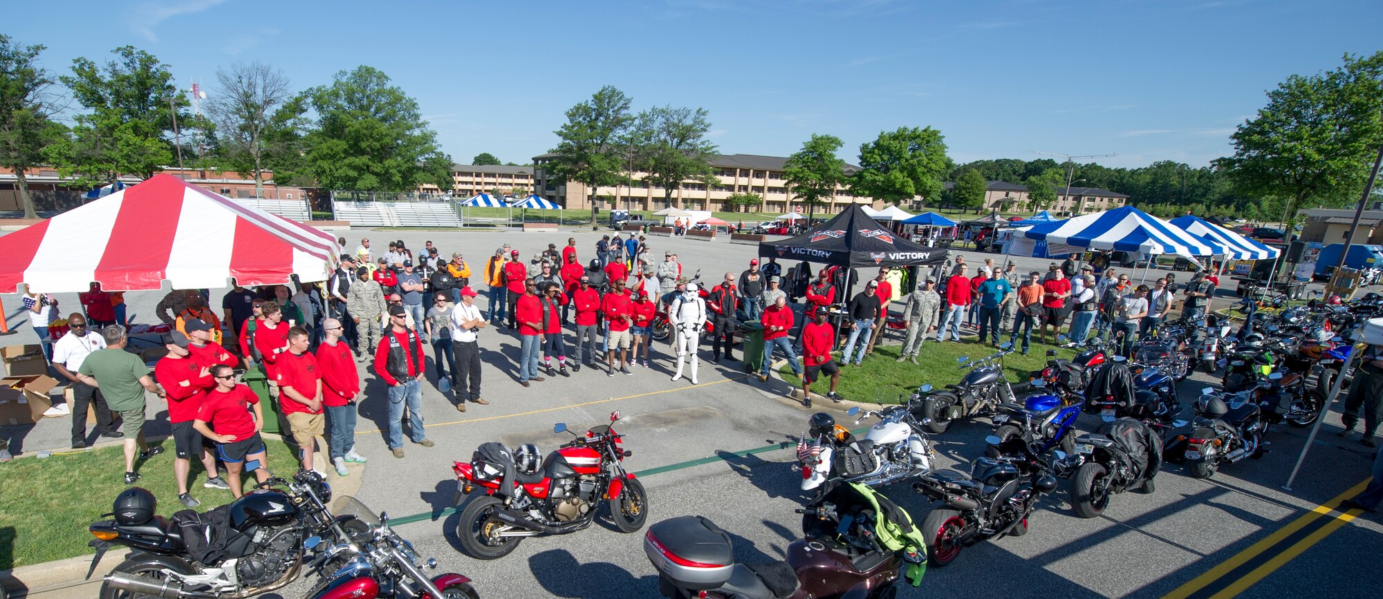 Motorcycle Safety Day attendees listen to Col. Brad Hoagland, 11th Wing and Joint Base Andrews commander, during opening remarks on Joint Base Andrews, Md., June 9, 2016. The day included vendors, local clubs, food, demonstrations, riding groups and prize giveaways. (U.S. Air Force photo by Senior Airman Ryan J. Sonnier/RELEASED)