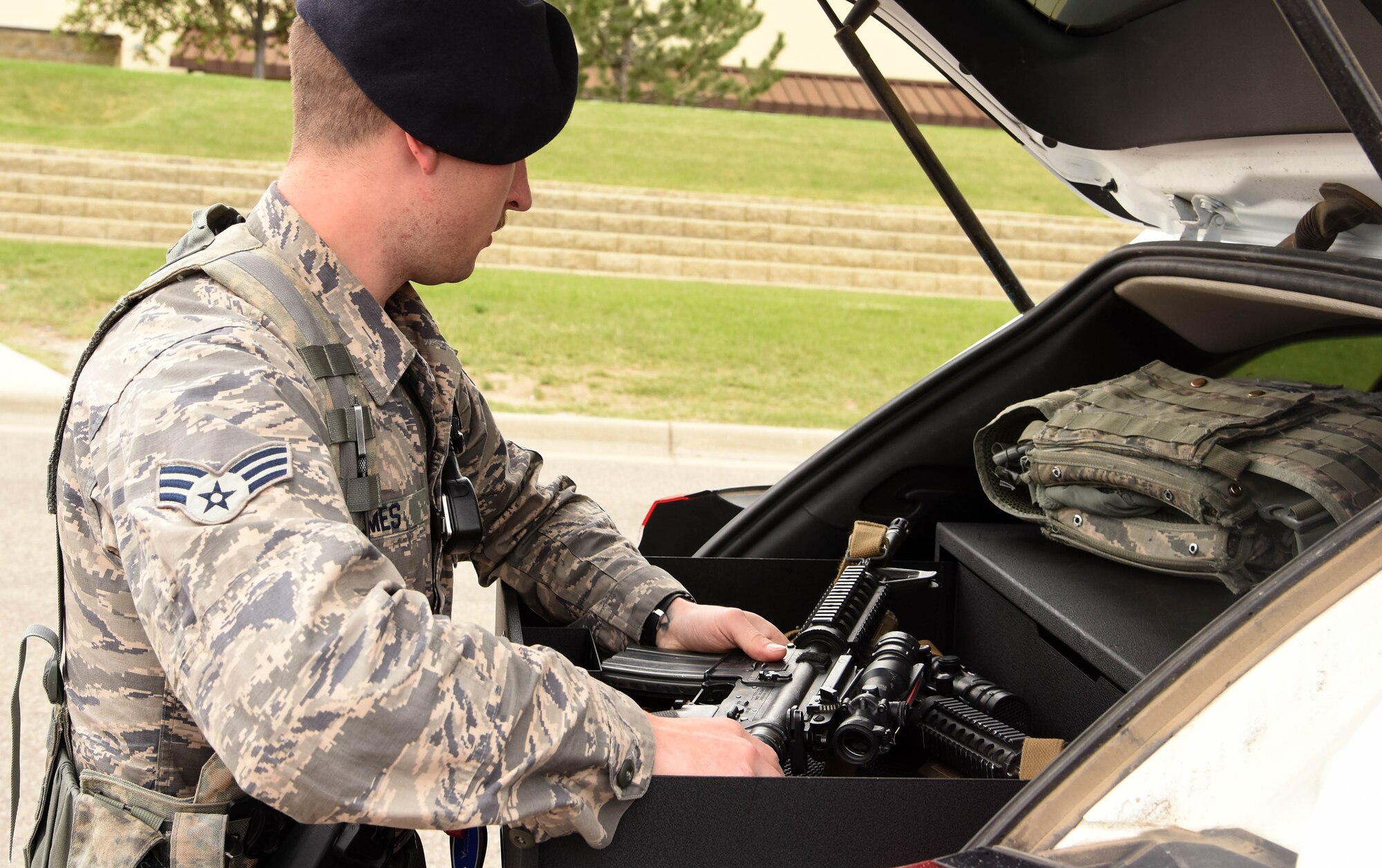 Senior Airman Jonathan James, 341st Security Forces Squadron installation patrolman, secures his weapon in the trunk of the car May 23, 2016, at Malmstrom Air Force Base, Mont. James patrols the base to make sure everyone is safe, and people are following the rules set in place. (U.S. Air Force photo/Senior Airman Jaeda Tookes)