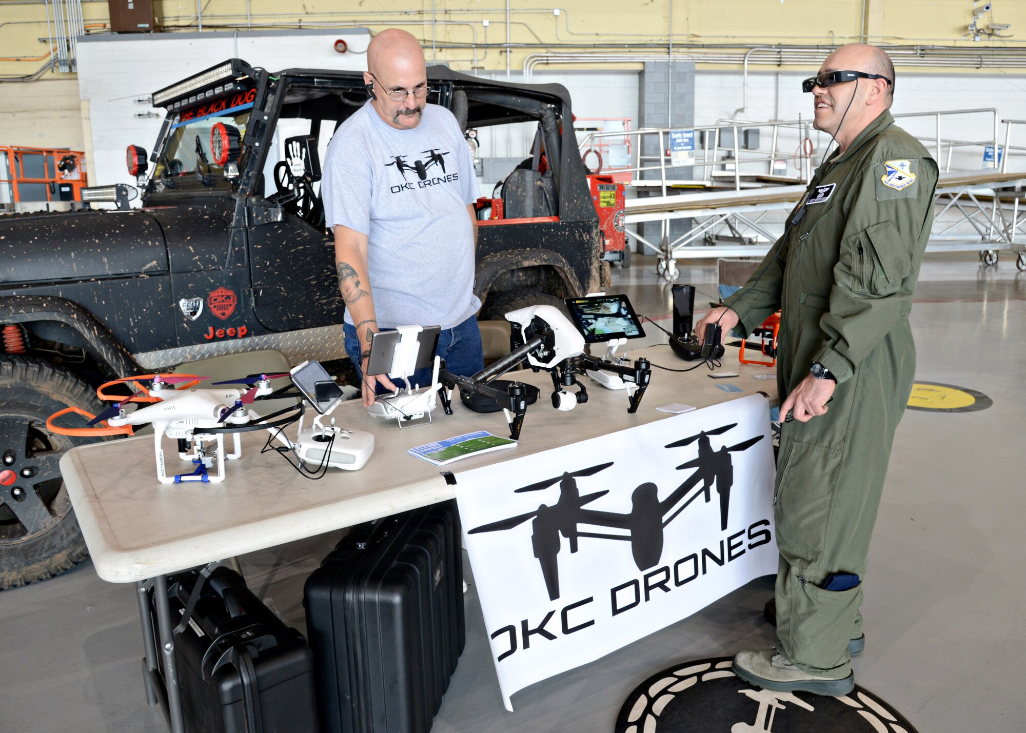 Don Price, with OKC Drones, assisted Master Sgt. Sergio Perez, with the 960th Airborne Air Control Squadron, with some of the latest drone technology. Mr. Price’s booth was one of many who attended the May 26 Safety Fair. (Air Force photo by Kelly White/Released)