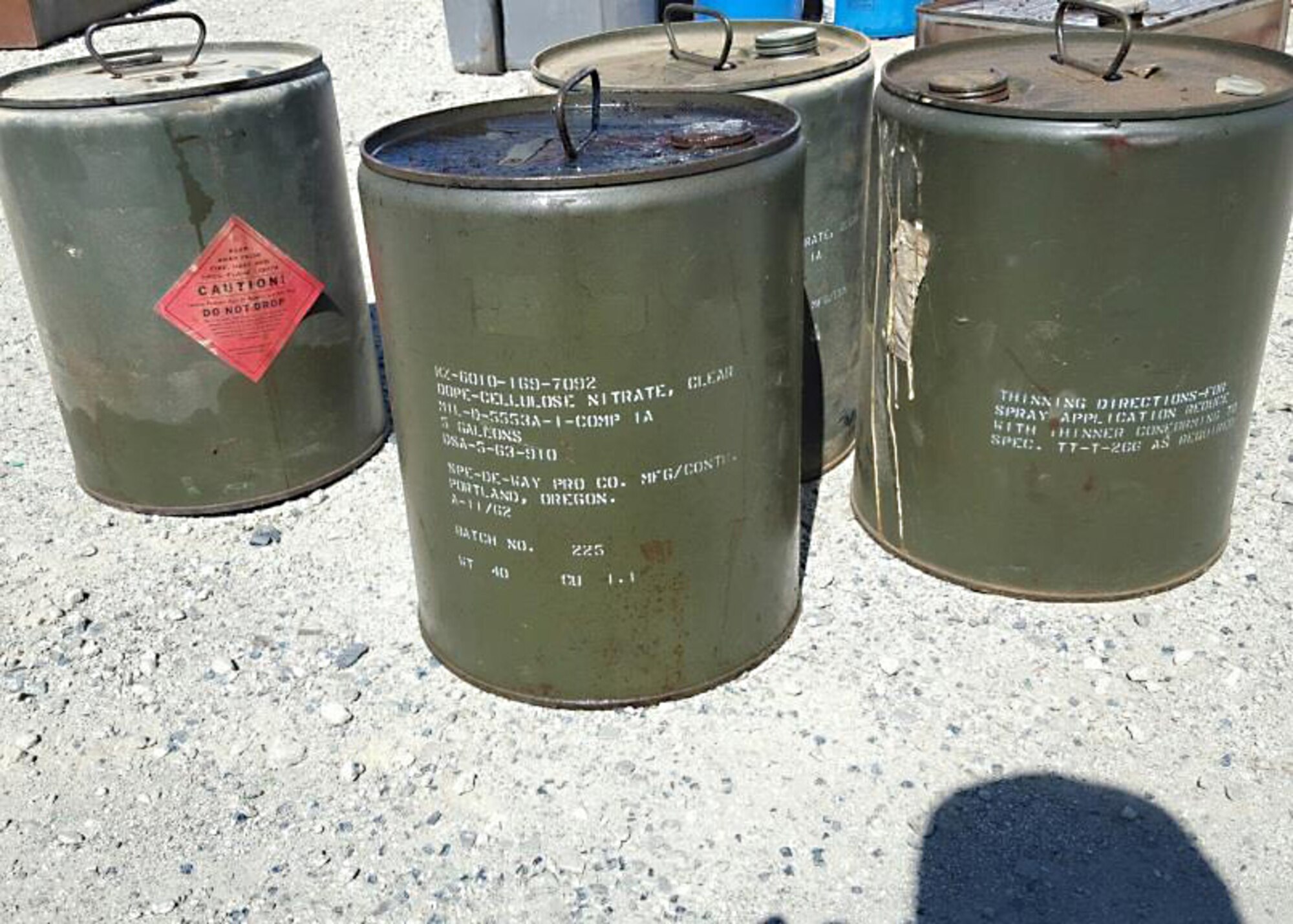 Twenty gallons of nitrocellulose-dope lacquer were discovered at a waste facility in Lancaster, California. The chemical was traced back to General William J. Fox Airfield and is highly volatile. The City of Lancaster contacted Edwards AFB to ask for assistance in disposing of the chemical. (U.S. Air Force photo by Kenji Thuloweit)