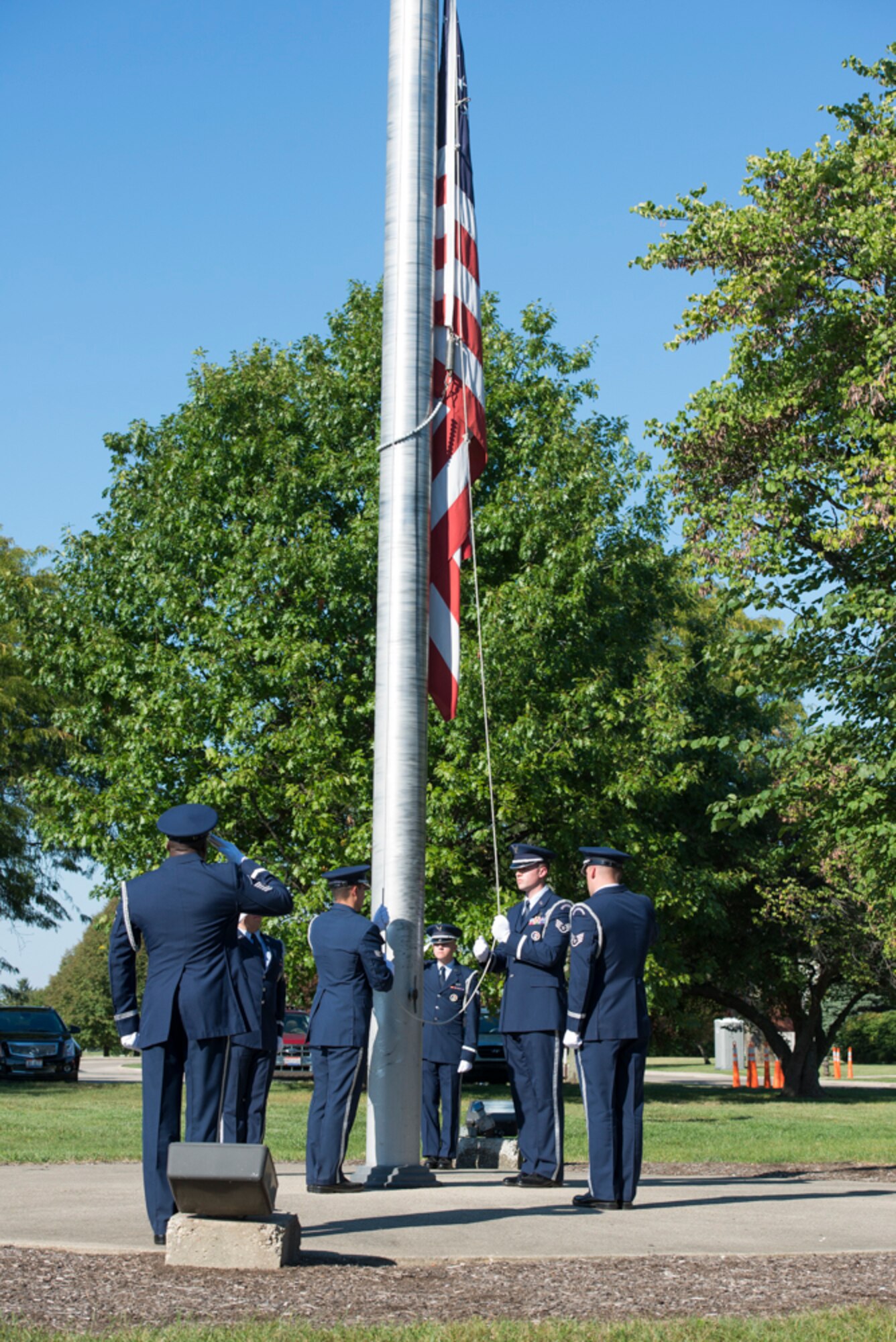 The Wright-Patterson Honor Guard lowers the flag during a retreat ceremony. (U.S. Air Force photo/Wesley Farnsworth)