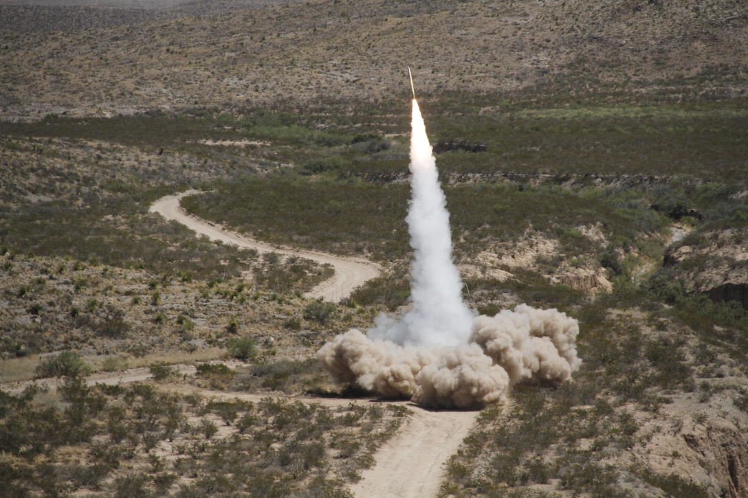 A guided multiple launch rocket system (GMLRS) rocket is launched from a High-Mobility Artillery Rocket System, mounted on a truck, during exercise Iron Rage at McGregor Range, N.M. Saturday. The rocket went just under 30 km, impacting about 5 meters from the target. 