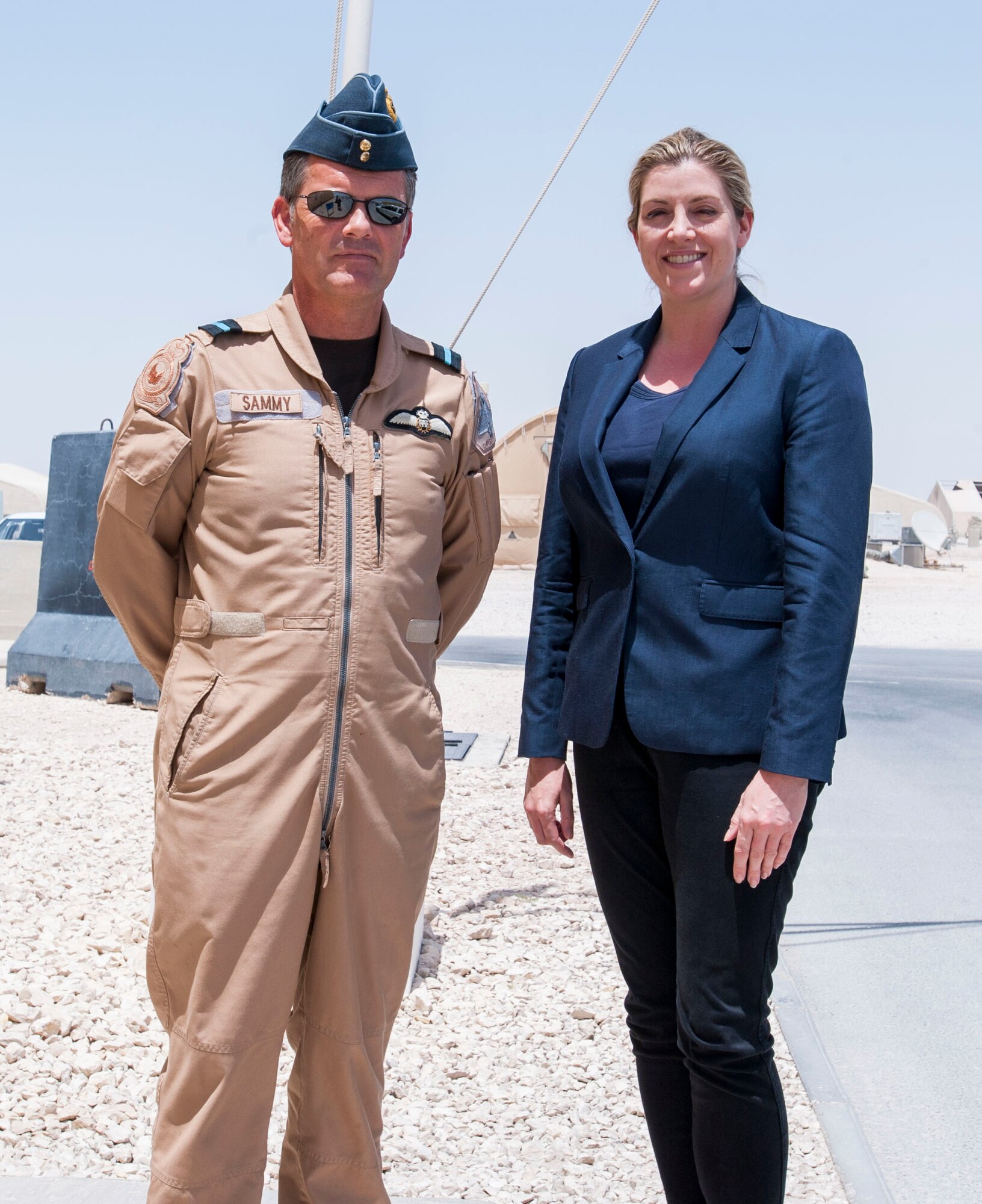 Penny Mordaunt, U.K Minister of State for the Armed Forces, poses with Air Commodore “Sammy” Sampson, 83rd Expeditionary Air Group commander, during her recent visit to the 83rd EAG, June 3, 2016 at Al Udeid Air Base, Qatar. The visit allowed Mordaunt to see first-hand how the group operates as part of the global coalition. (U.S. Army photo by Sgt. 1st Class Patricia Deal)