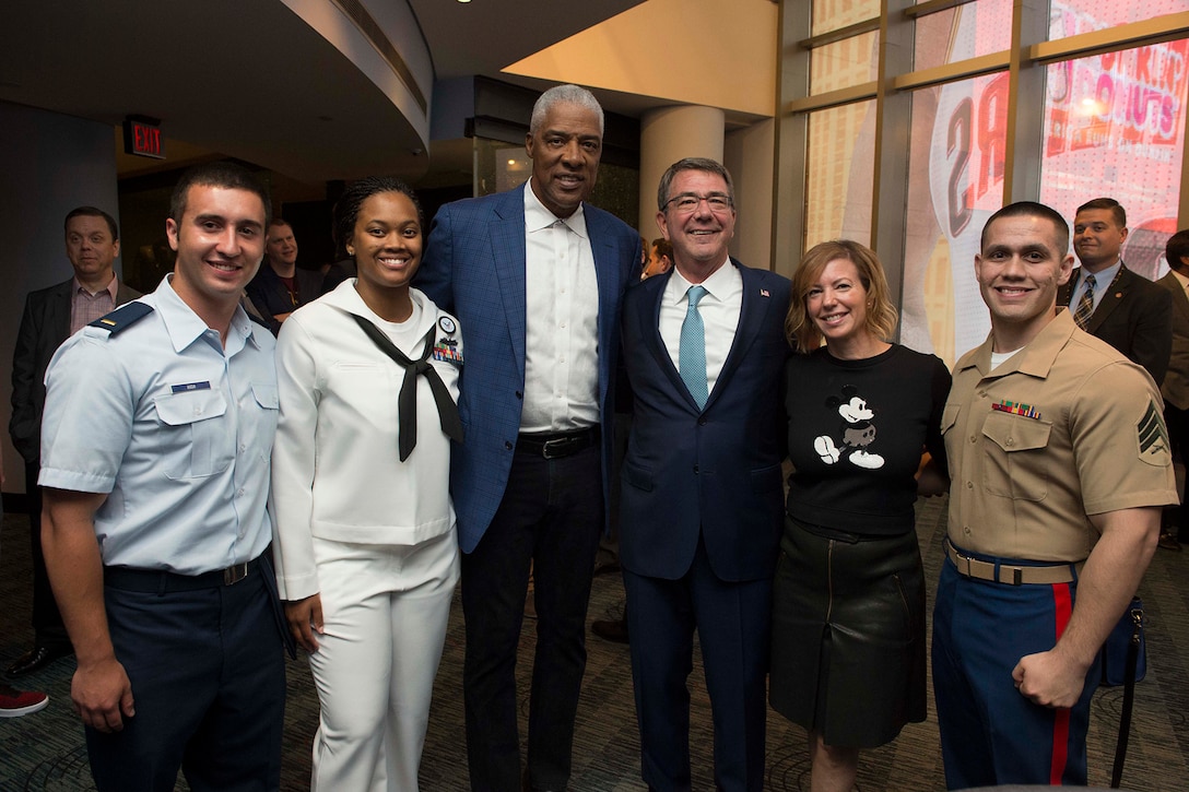 Defense Secretary Ash Carter, his wife Stephanie and NBA legend Julius 'Dr. J' Erving pose with service members at Game 4 of the 2016 NBA Finals in Cleveland, June 10, 2016. DoD photo by Navy Petty Officer 1st Class Tim D. Godbee