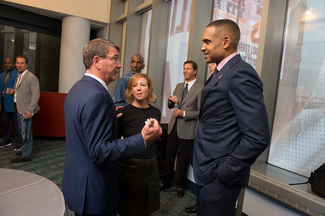 Defense Secretary Ash Carter speaks to former NBA basketball star Grant Hill at Game 4 of the 2016 NBA Finals in Cleveland, June 10, 2016. DoD photo by Navy Petty Officer 1st Class Tim D. Godbee