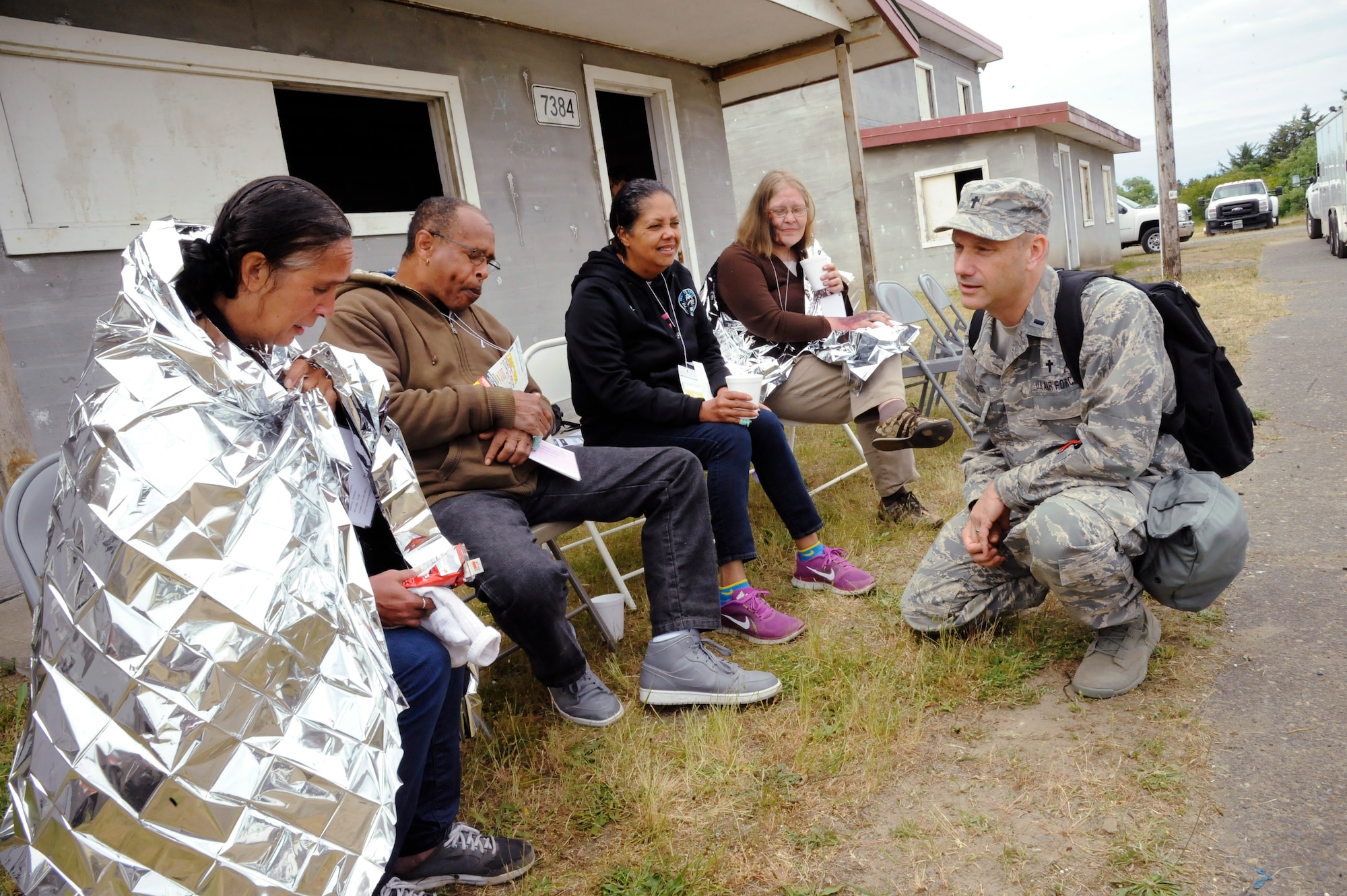 Oregon Air National Guard Chaplain Bob Edwards spends time listening to victims who survived a tsunami during the Cascadia Rising exercise at Camp Rilea, Warrenton, Ore., June 9, 2016. Cascadia Rising scenario is a 9.0 magnitude earthquake along the Cascadia Subduction Zone (CSZ) resulting in a tsunami, testing first responders, emergency management and public safety officials in the Pacific Northwest. (U.S. Air National Guard photo by Tech. Sgt. John Hughel, 142nd Fighter Wing Public Affairs/Released) 