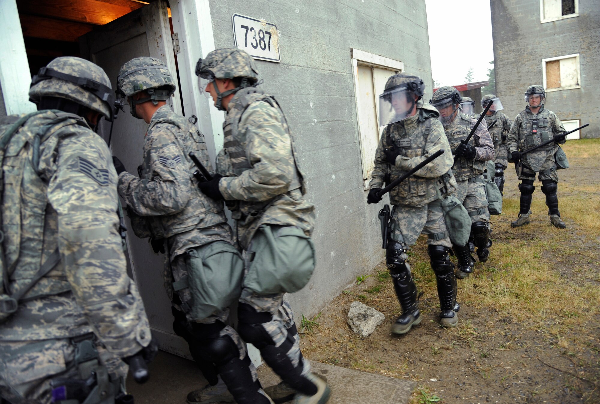 Oregon Air National Guard Security Force members from the 142nd Fighter Wing and 173rd Fighter Wing train together as they conduct security search operations at Camp Rilea training village, Warrenton, Ore., during the Cascadia Rising exercise, June, 10, 2016. Cascadia Rising scenario is a 9.0 magnitude earthquake along the Cascadia Subduction Zone (CSZ) resulting in a tsunami, testing first responders, emergency management and public safety officials in the Pacific Northwest. (U.S. Air National Guard photo by Tech. Sgt. John Hughel, 142nd Fighter Wing Public Affairs/Released) 