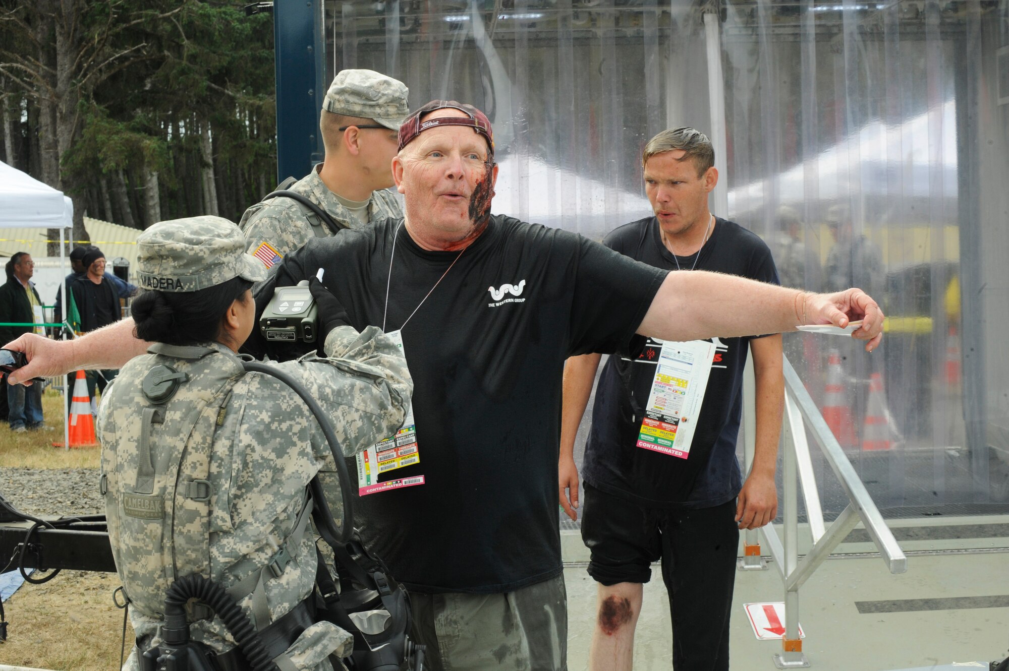 The CBRNE Enhanced Force Response Force Package (CERFP) members from the Oregon and Kentucky National Guard treat injured victims during the Cascadia Rising exercise at Camp Rilea, Warrenton, Ore., June 9, 2016. Cascadia Rising scenario is a 9.0 magnitude earthquake along the Cascadia Subduction Zone (CSZ) resulting in a tsunami, testing first responders, emergency management and public safety officials in the Pacific Northwest. (U.S. Air National Guard photo by Tech. Sgt. John Hughel, 142nd Fighter Wing Public Affairs/Released)