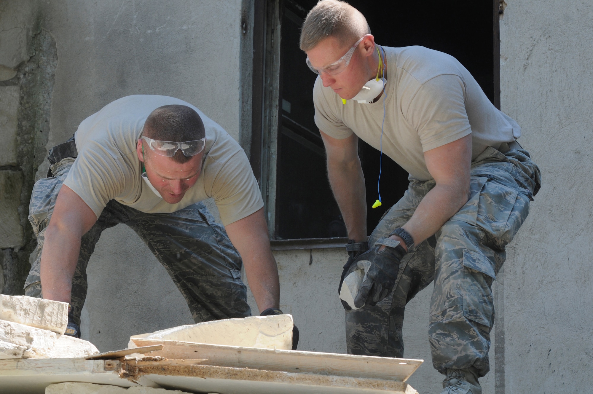 U.S. Air Force Master Sgt. Joshua Thompson and U.S. Air Force Tech. Sgt. Kaleb Henry, both from the Kentucky Air National Guard’s 123rd Civil Engineer Squadron in Louisville, Kentucky, measure a piece of cement to be used in the kitchen at Special School #12 in Chisinau, Moldova, June 5, 2016. More than 35 Airmen from the unit are renovating the institution, which is the only school in Moldova specifically for deaf and special-needs students. The humanitarian project is a partnership with the Office of Defense Cooperation and U.S. European Command, with funds being provided by the National Guard Bureau. (U.S. Air National Guard photo by Tech. Sgt. Vicky Spesard)