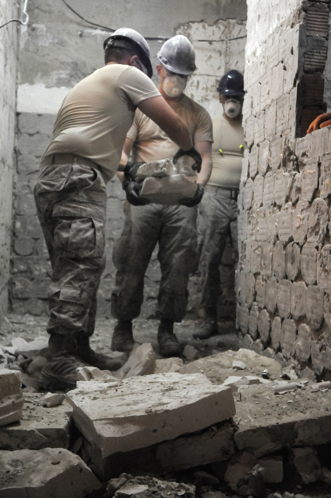 Airmen from the Kentucky Air National Guard’s 123rd Civil Engineer Squadron in Louisville, Kentucky, remove stone and brick work from the kitchen of Special School #12 in Chisinau, Moldova, June 5, 2016. More than 35 Airmen from the unit are renovating the institution, which is the only school in Moldova specifically for deaf and special-needs students. The humanitarian project is a partnership with the Office of Defense Cooperation and U.S. European Command, with funds being provided by the National Guard Bureau. (U.S. Air National Guard photo by Tech. Sgt. Vicky Spesard)