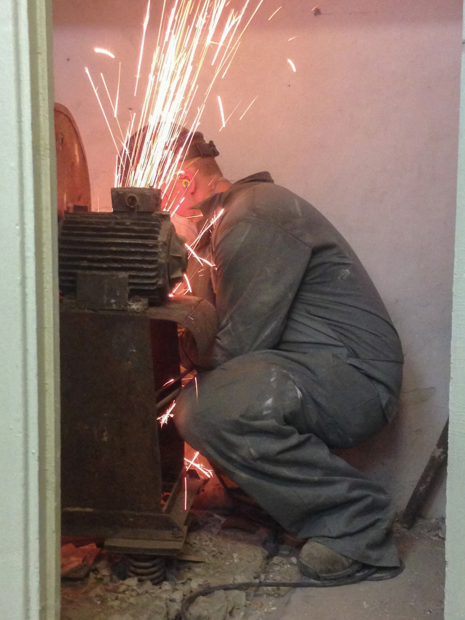 An Airman from Kentucky Air National Guard’s 123rd Civil Engineer Squadron in Louisville, Kentucky, cuts rusted metal from behind the kitchen wall of Special School #12 in Chisinau, Moldova, June 4, 2016. More than 35 Airmen from the unit are renovating the institution, which is the only school in Moldova specifically for deaf and special-needs students. The humanitarian project is a partnership with the Office of Defense Cooperation and U.S. European Command, with funds being provided by the National Guard Bureau. (U.S. Air National Guard photo by Tech. Sgt. Vicky Spesard)