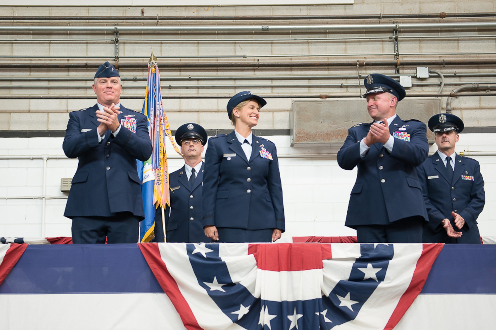 Colonel Virginia Doonan, center, became commander of the 102nd Intelligence Wing during a Change of Command ceremony today. Doonan succeeded Brig. Gen. James LeFavor, right, who served as commander since 2013. Presiding over the event was Brig. Gen. Robert Brooks, commander of the Massachusetts Air National Guard, pictured left. (U.S. Air National Guard photo by Tech. Sgt. Kerri Spero/Released)