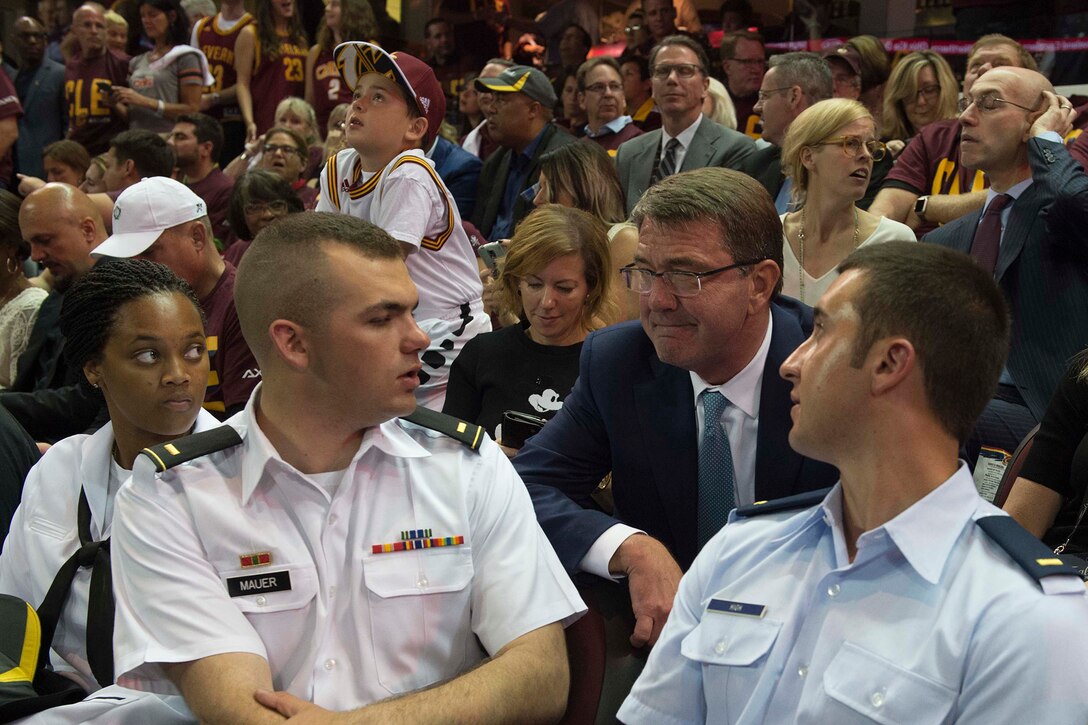 Defense Secretary Ash Carter talks to service members during Game 4 of the 2016 NBA Finals in Cleveland, June 10, 2016. Four service members representing the Army, Navy, Marine Corps and Air Force were honored on the court in a pre-game ceremony. DoD photo by Navy Petty Officer 1st Class Tim D. Godbee