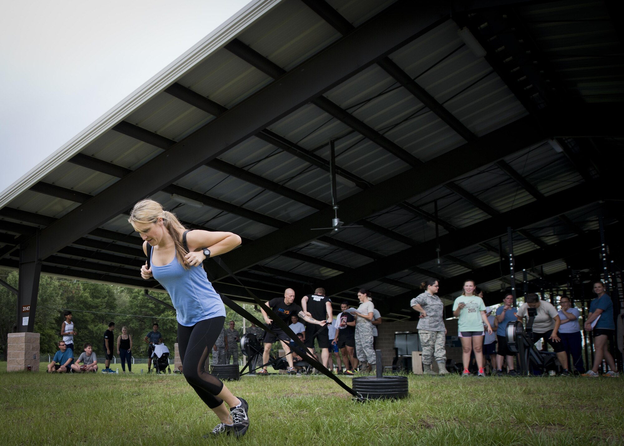 Maj. Pamela Wilson, the 919th Special Operations Communications Squadron commander, starts her turn pulling a weighted sled during a team combat fit competition June 11 at Duke Field, Fla.  The three-round competition pushed the teams to their limits with repetitive weight lifting, rowing, sled-pulling and other kinetic activities.  (U.S. Air Force photo/Tech. Sgt. Sam King)