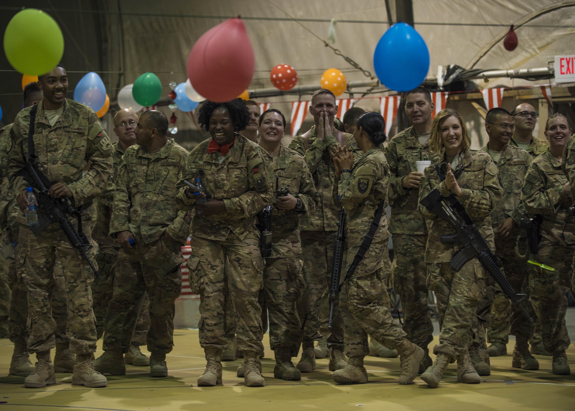 Military members come together for a carnival block party hosted by the 455th Expeditionary Force Support Squadron, at Bagram Airfield, Afghanistan, June 11, 2016. The 455th EFSS host the block parties monthly to bring together coalition forces in a fun, inviting, and friendly environment. (U.S. Air Force photo by Senior Airman Justyn M. Freeman)