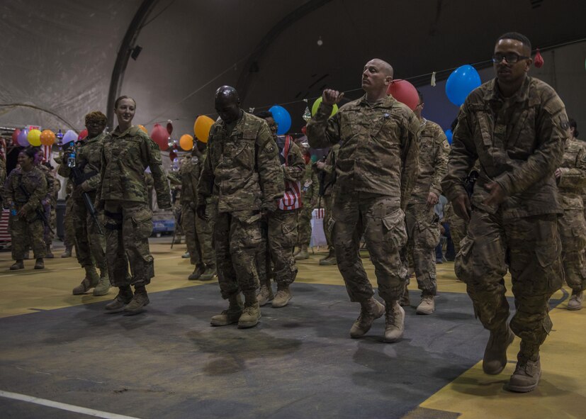 Servicemembers dance the night away during a carnival block party hosted by the 455th Expeditionary Force Support Squadron, at Bagram Airfield, Afghanistan, June 11, 2016. The goal for these events hosted by the 455th EFSS is to provide a boost of morale to the Bagram Airfield community. (U.S. Air Force photo by Senior Airman Justyn M. Freeman)