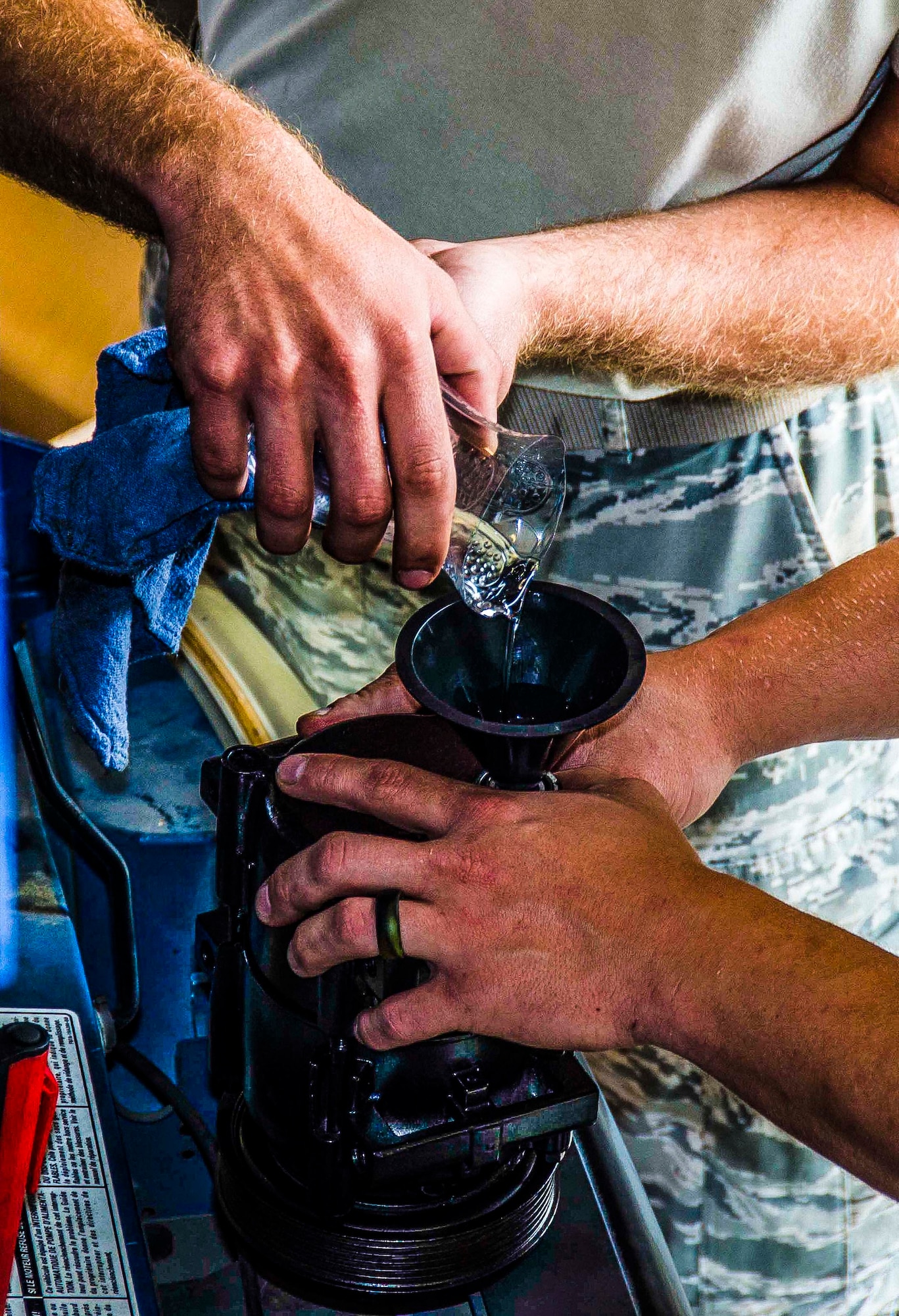Tech. Sgt. Chad Bennett and Staff Sgt. Wade Spradlin, Vehicle Maintainers from the 117th Logistical Readiness Squadron at the 117th Air Refueling Wing, replace a broken air compressor inside a security forces truck June 11, 2016 in Birmingham, Ala. (Air National Guard photo by Senior Airman Wes Jones/Released)