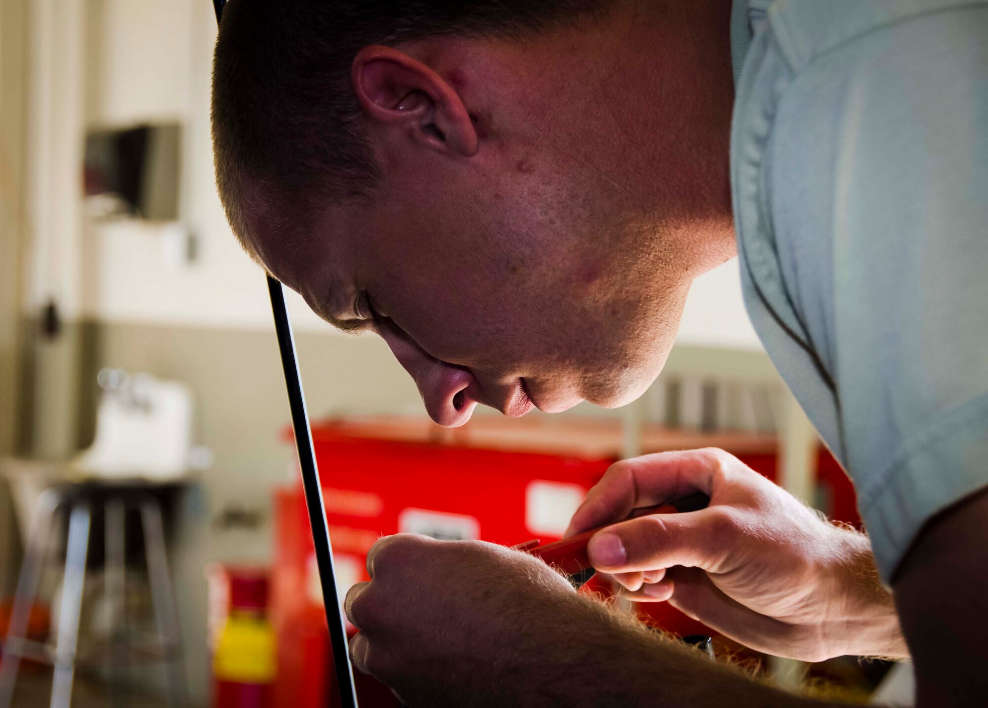 Tech. Sgt. Chad Bennett and Staff Sgt. Wade Spradlin, Vehicle Maintainers from the 117th Logistical Readiness Squadron at the 117th Air Refueling Wing, replace a broken air compressor inside a security forces truck June 11, 2016 in Birmingham, Ala. (Air National Guard photo by Senior Airman Wes Jones/Released)
