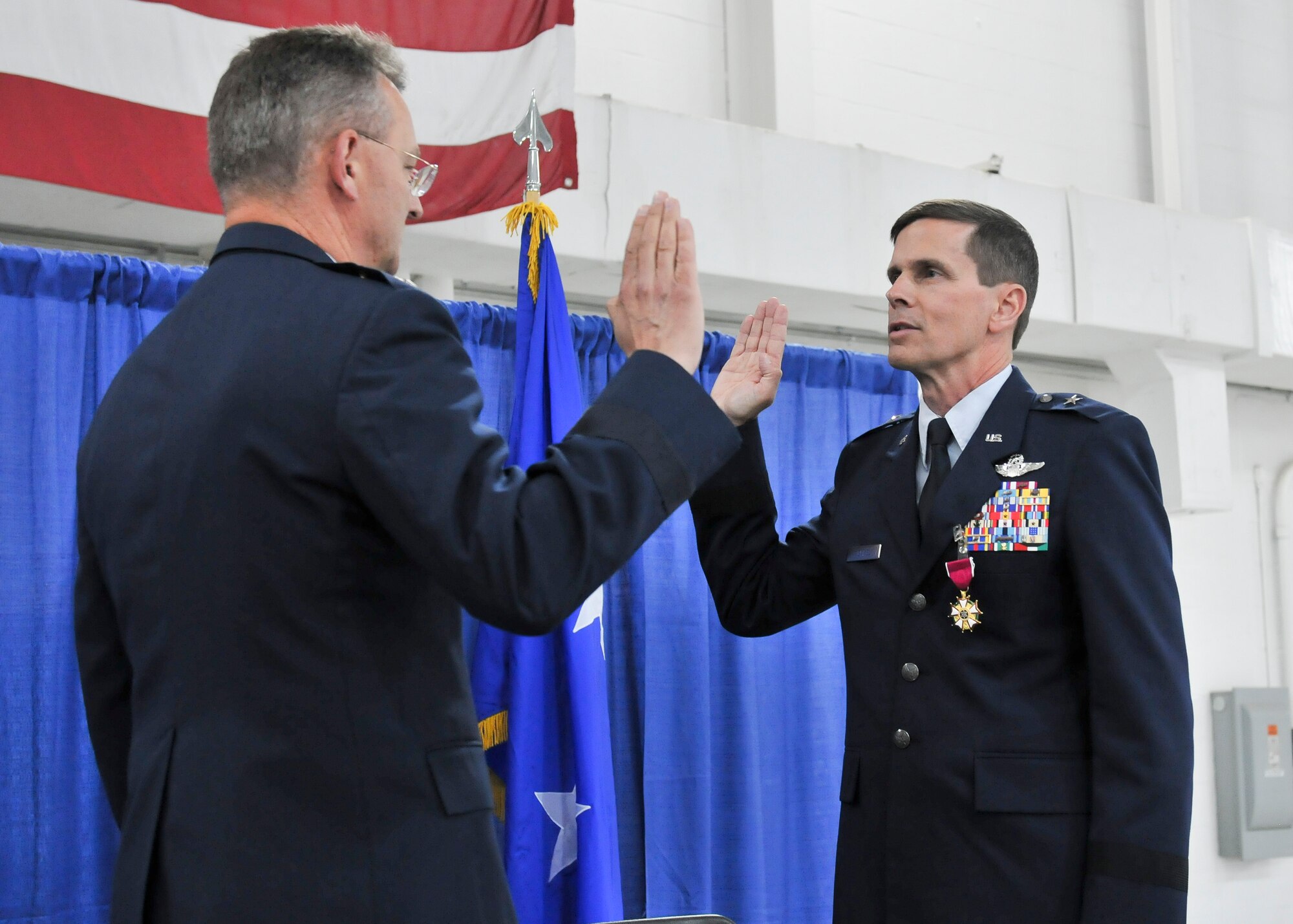 New York Air National Guard Brig. Gen. Greg Semmel (right) reaffirms his oath of office with Maj. Gen. Anthony German (left), the Adjutant General of the State of New York, during his promotion ceremony held on Hancock Field in Syracuse, NY Friday, June 10. Semmel will now serve as Assistant Adjutant General – Air for the New York Air National Guard. (U.S. Air National Guard photo by Tech. Sgt. Jeremy M. Call/Released)