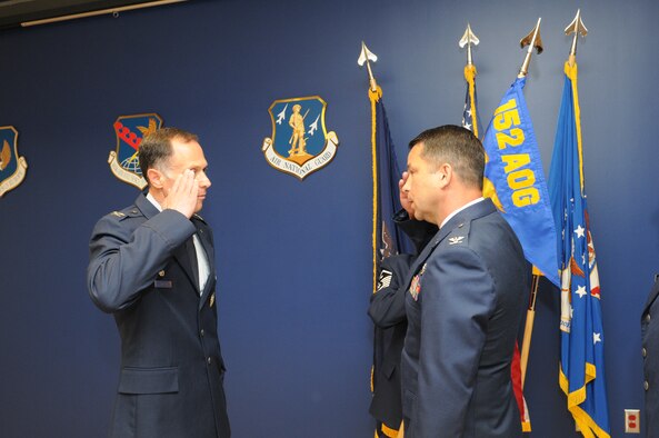 New York Air National Guard Col. Brian VanKouwenberg (right) salutes Col. Michael Comella (left) as he formally assumes command of the 152nd Air Operations Group, during an assumption-of-command ceremony at Hancock Field in Syracuse, NY Saturday, June 11. (U.S. Air National Guard photo by Tech. Sgt. Justin A. Huett/Released)