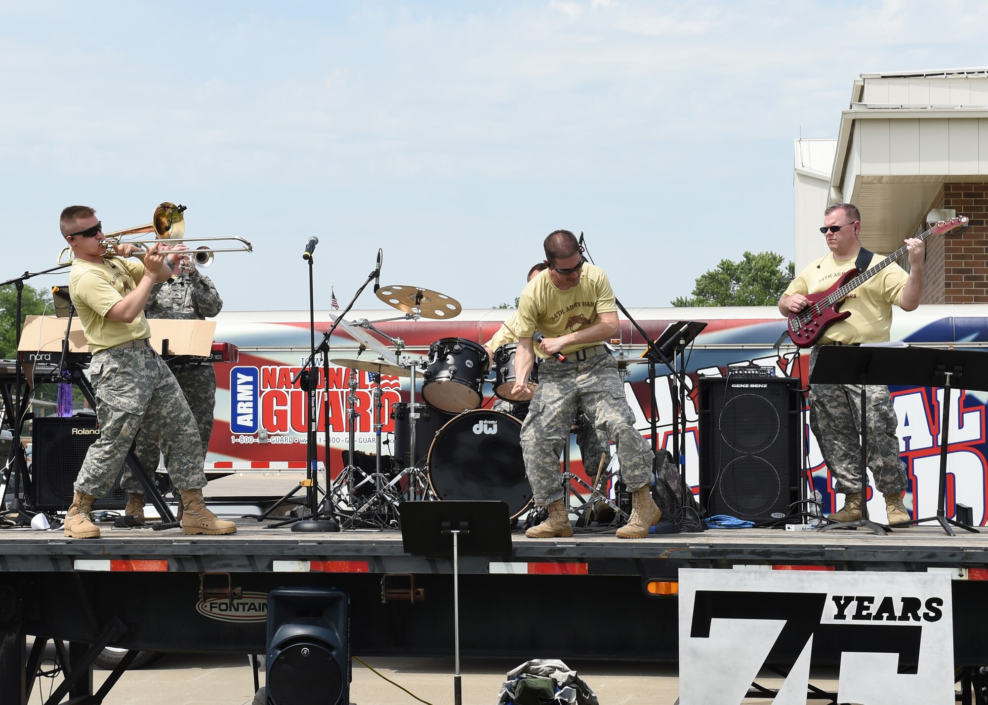 Current members and alumni of the 132d Wing participate in the wing's 75th Anniversary celebration June 11, 2016, at the 132d Wing in Des Moines, Iowa. The celebration featured aircraft displays, bouncey houses, The Sidewinders Army Band and numerous vendors. (U.S. Air National Guard photo by Staff Sgt. Michael J. Kelly/Released)