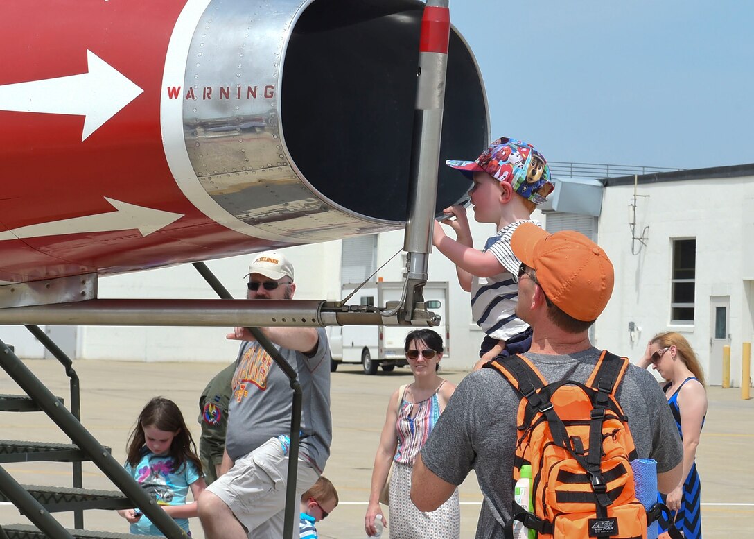 Current members and alumni of the 132d Wing participate in the wing's 75th Anniversary celebration June 11, 2016, at the 132d Wing in Des Moines, Iowa. The celebration featured aircraft displays, bouncey houses, The Sidewinder Army Band and numerous vendors. (U.S. Air National Guard photo by Staff Sgt. Michael J. Kelly/Released)