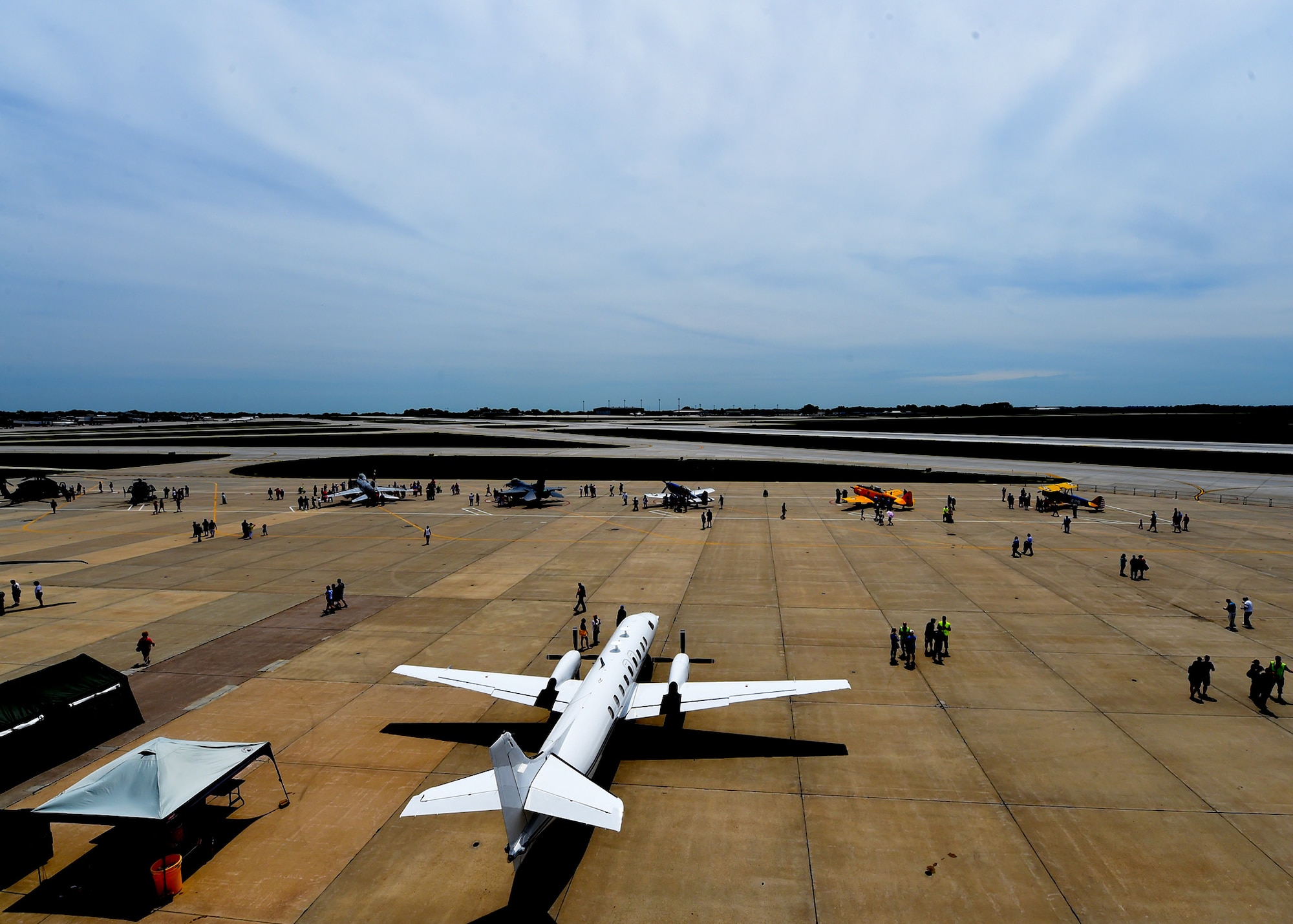 Current members and alumni of the 132d Wing participate in the wing's 75th Anniversary celebration June 11, 2016, at the 132d Wing in Des Moines, Iowa. The celebration featured aircraft displays, bouncey houses, the Army band Sidewinders and numerous vendors. (U.S. Air National Guard photo by Staff Sgt. Michael J. Kelly/Released)