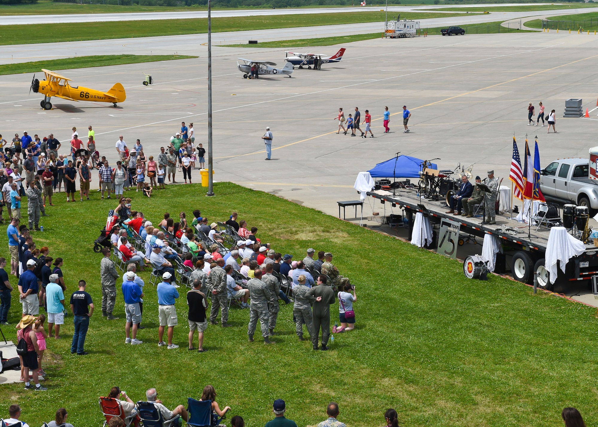 Current members and alumni of the 132d Wing participate in the wing's 75th Anniversary celebration June 11, 2016, at the 132d Wing in Des Moines, Iowa. The celebration featured aircraft displays, bouncey houses, the Army band Sidewinders and numerous vendors. (U.S. Air National Guard photo by Staff Sgt. Michael J. Kelly/Released)