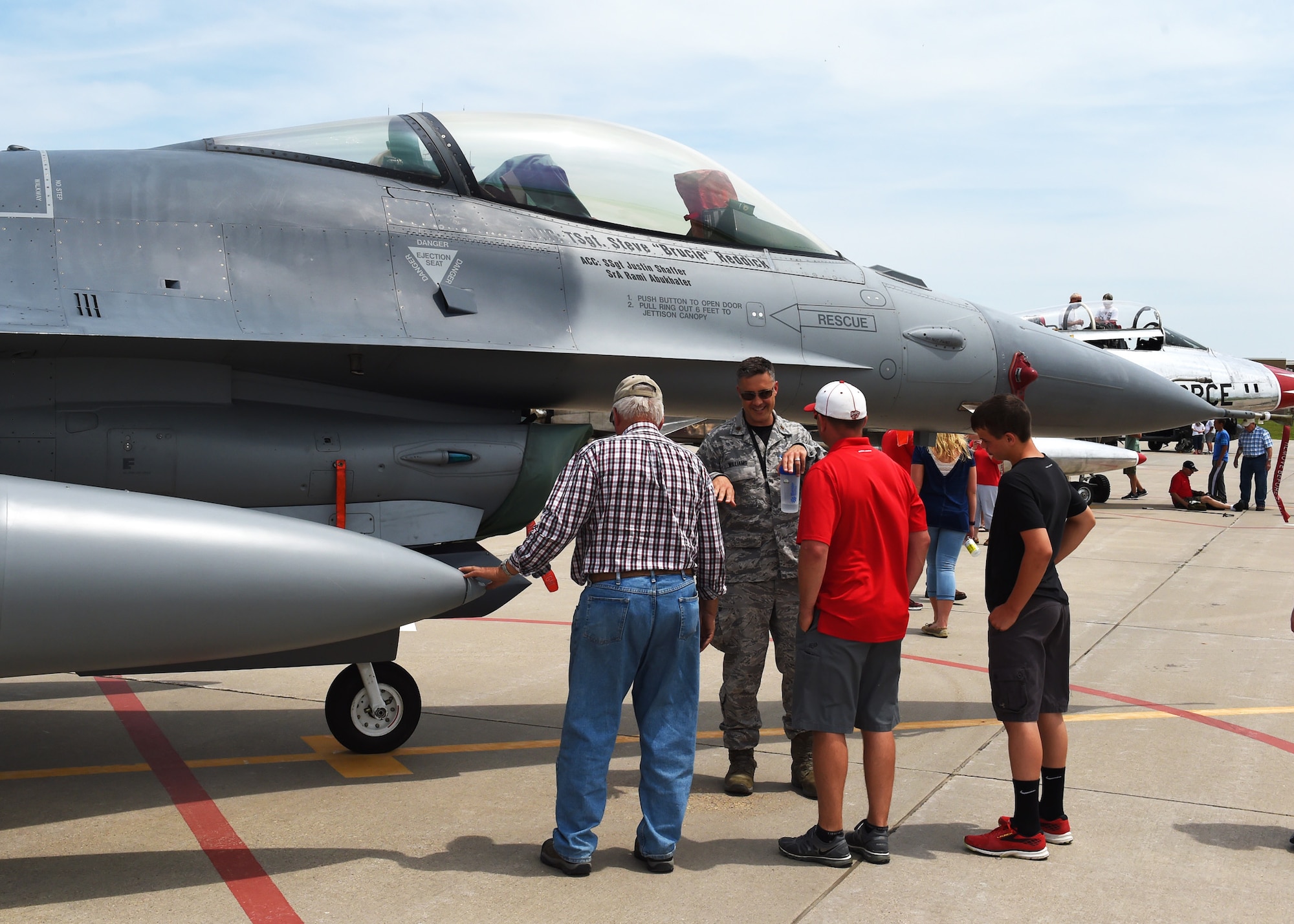 Current members and alumni of the 132d Wing participate in the wing's 75th Anniversary celebration June 11, 2016, at the 132d Wing in Des Moines, Iowa. The celebration featured aircraft displays, bouncey houses,The Sidewinders Army rock band and numerous vendors. (U.S. Air National Guard photo by Staff Sgt. Michael J. Kelly/Released)