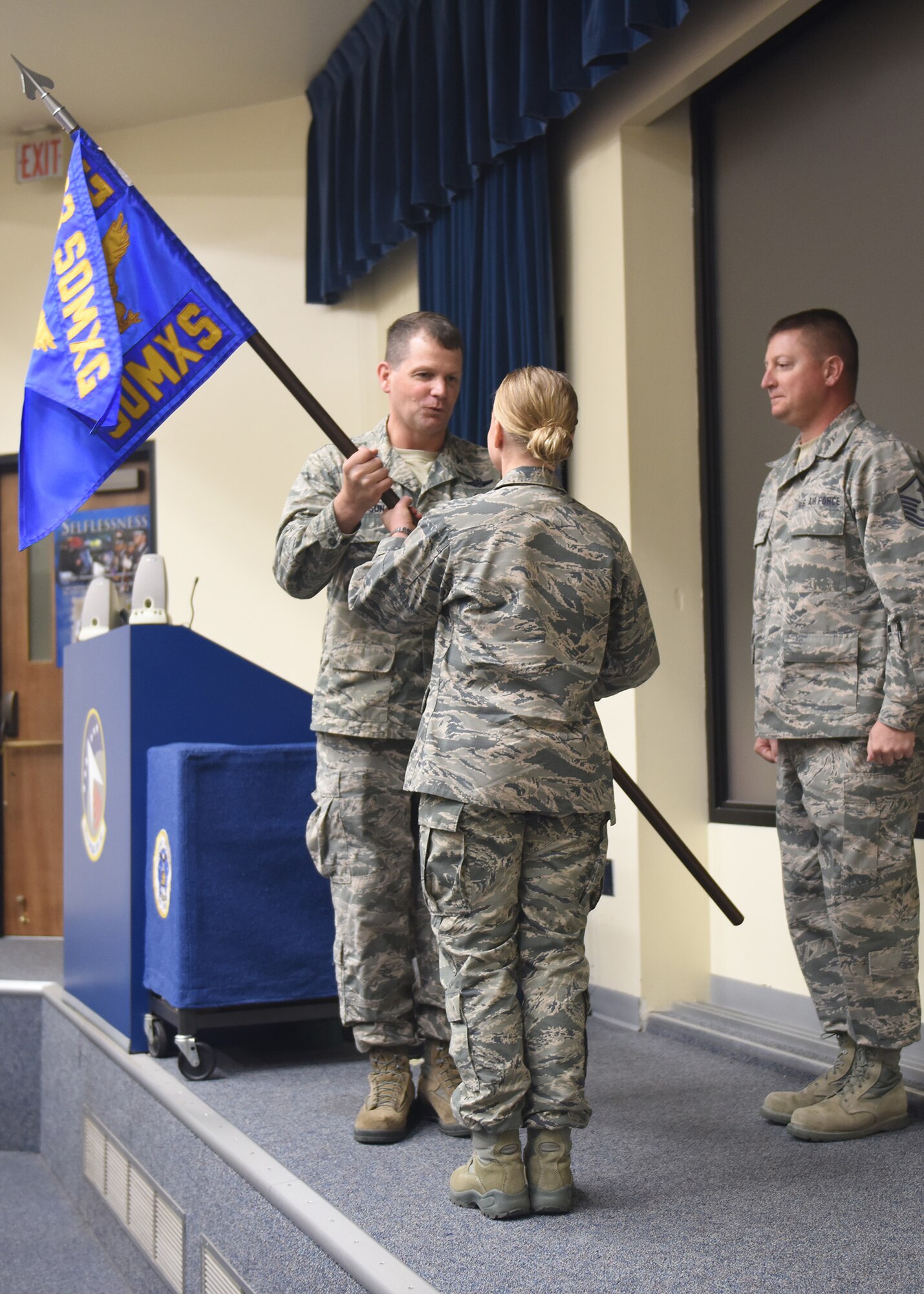 Col. Michael Watson, former 193rd Special Operations Maintenance Squadron commander, presents the guidon to Lt. Col. Amy Crossley, 193rd Special Operations Maintenance Squadron commander, during a change-of-command ceremony June 11 at Middletown, Pennsylvania. Crossley is the first female maintenance squadron commander at the 193rd SOW. The ceremony began with preliminary honors and ended with the symbolic passing of the guidon, representing a new chapter for the wing. (U.S. Air National Guard photo by Airman 1st Class Julia Sorber/Released)