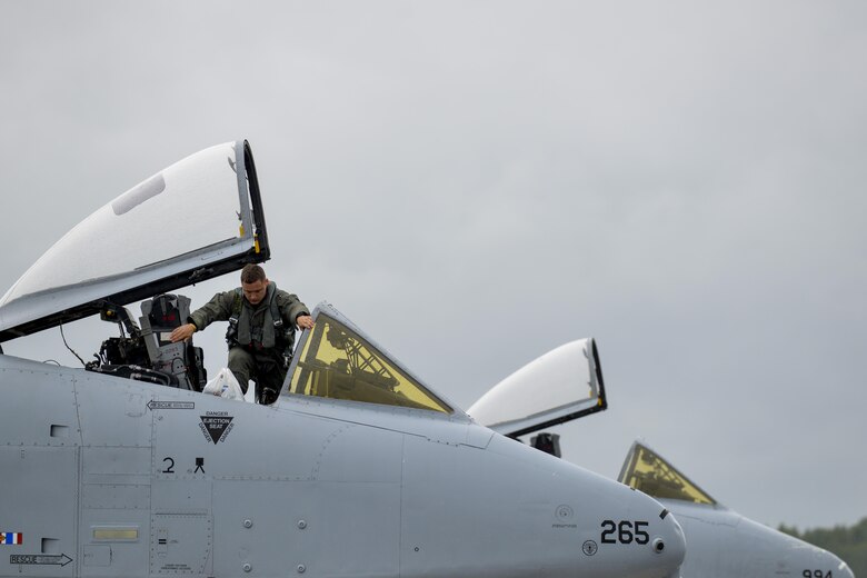 A pilot from the 107th Fighter Squadron, Selfridge Air National Guard Base, Michigan, exits an A-10C Thunderbolt II at Lielvarde Air Base, Latvia June 11, 2016. U.S. armed forces and Latvian airmen will participate in Saber Strike 16; a long-standing, U.S. Joint Chiefs of Staff-directed, U.S. Army Europe-led cooperative-training exercise, which has been conducted annually since 2010.  (U.S. Air Force photo/Senior Airman Nicole Keim)