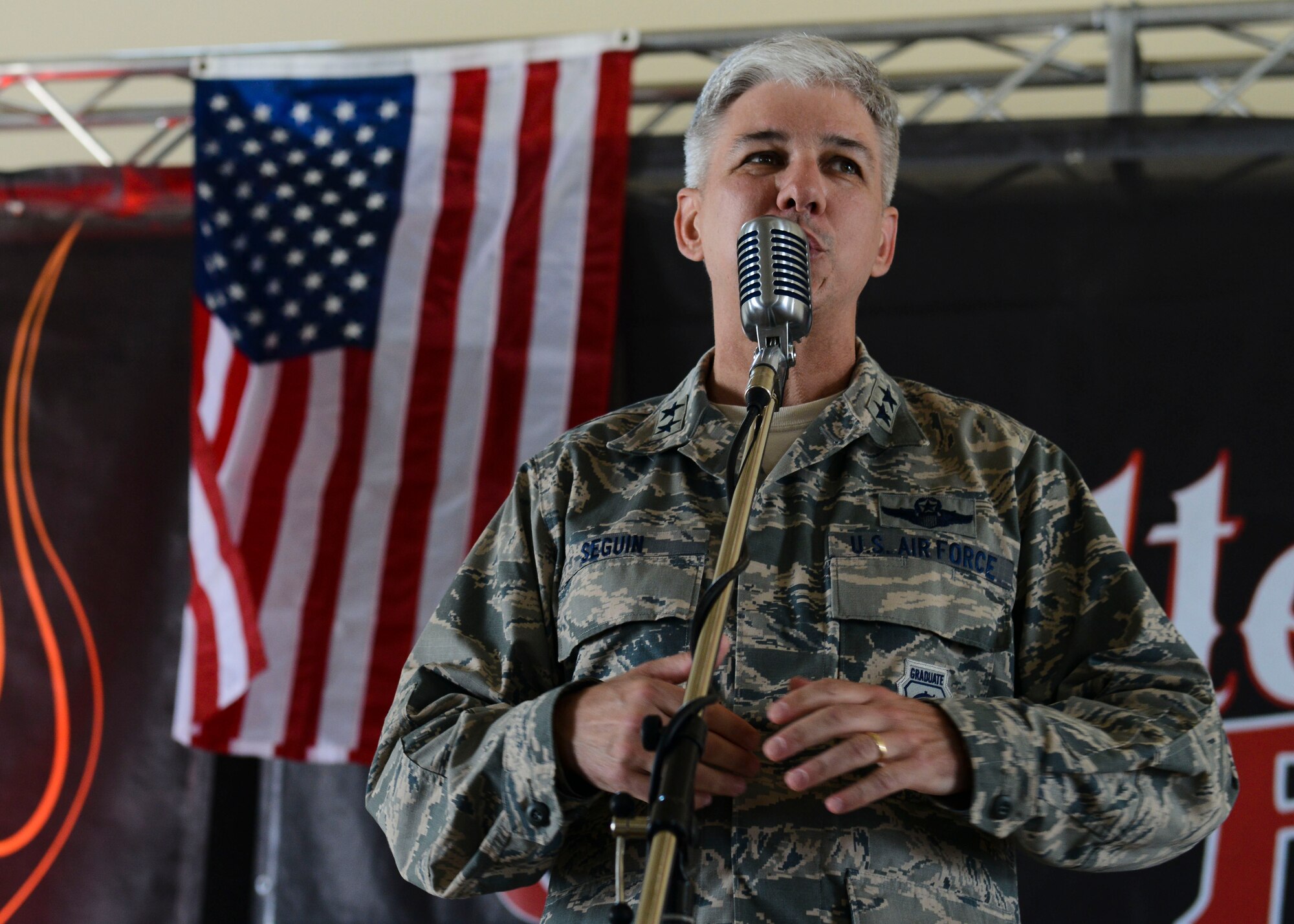 Maj. Gen. Barre Seguin, former 31st Fighter Wing commander, speaks during a wing picnic, June 9, 2016, at Aviano Air Base, Italy. The 31st FW hosted the picnic to show appreciation for Team Aviano’s dedication to mission success. (U.S. Air Force photo by Senior Airman Austin Harvill/Released)