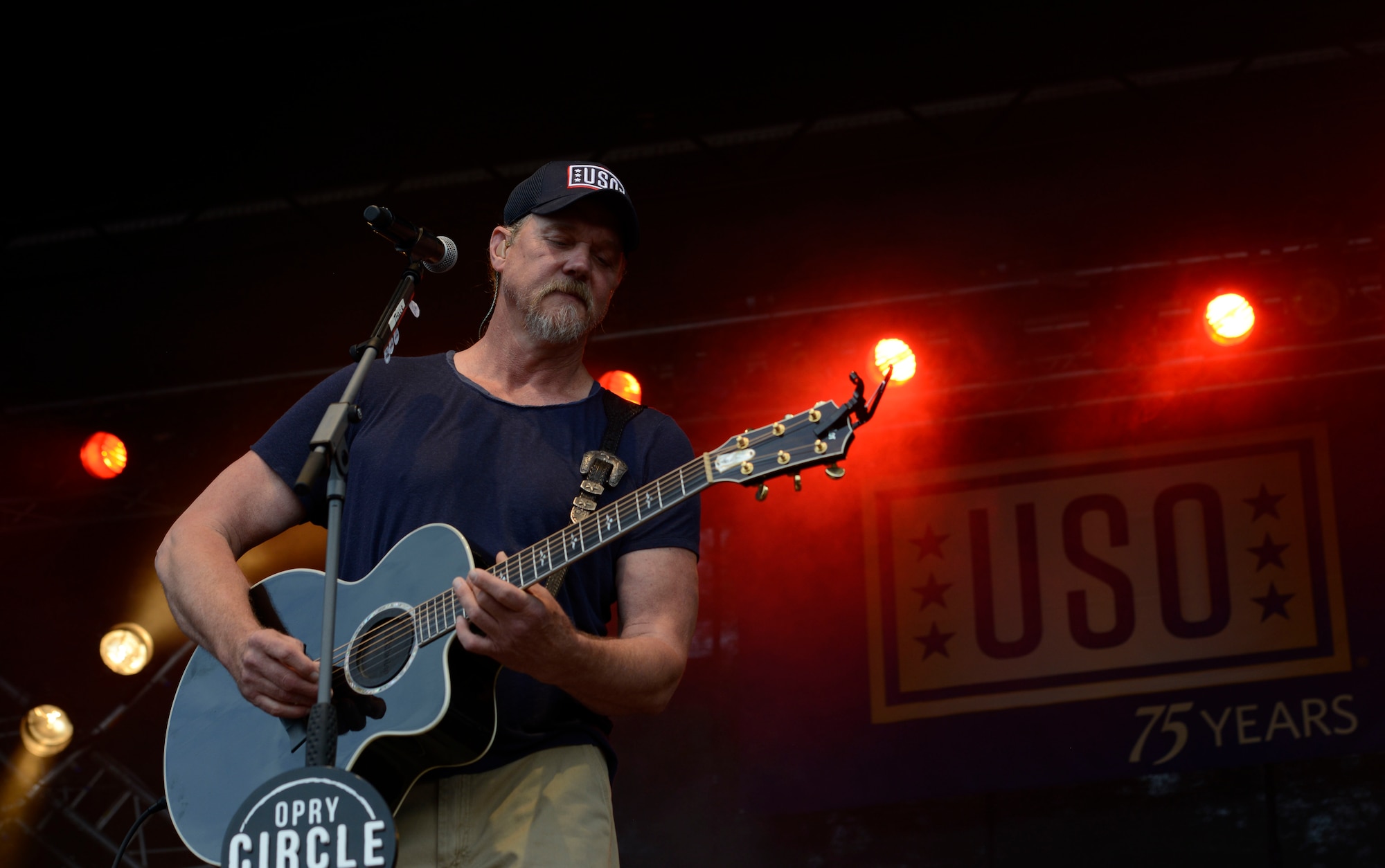 Trace Adkins, country music singer, plays his guitar during a free concert at Ramstein Air Base, Germany, June 11, 2016. The USO-sponsored concert was free to all Department of Defense members. (U.S. Air Force photo/ Airman 1st Class Joshua Magbanua)