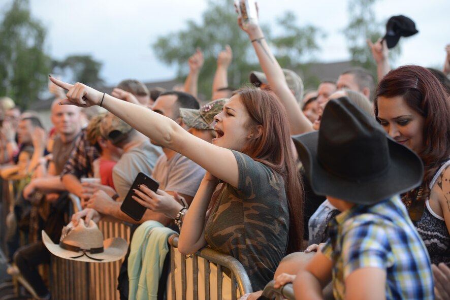 Fans enjoy a free concert performed by Trace Adkins, country music singer, at Ramstein Air Base, Germany, June 11, 2016. The concert was part of a three-nation tour, in which Adkins performed for Department of Defense members. (U.S. Air Force photo/ Airman 1st Class Joshua Magbanua)