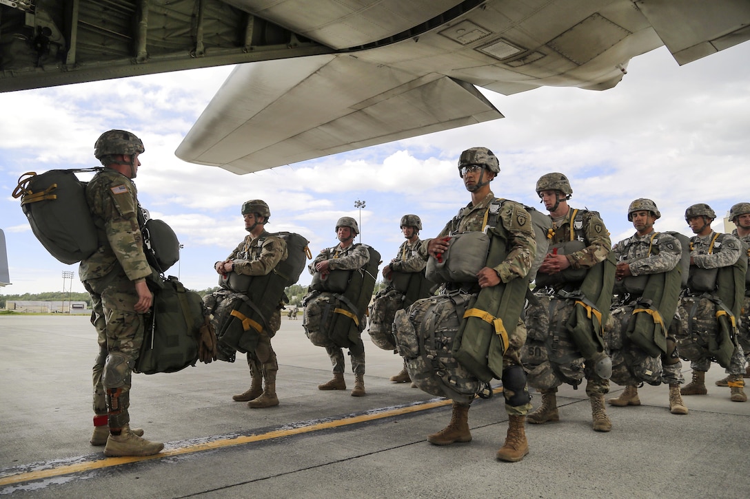 Paratroopers prepare to board a KC-130J Super Hercules aircraft before participating in an airborne operation during Arctic Aurora 2016 at Joint Base Elmendorf-Richardson, Alaska, June 2, 2016. Air Force photo by Alejandro Pena