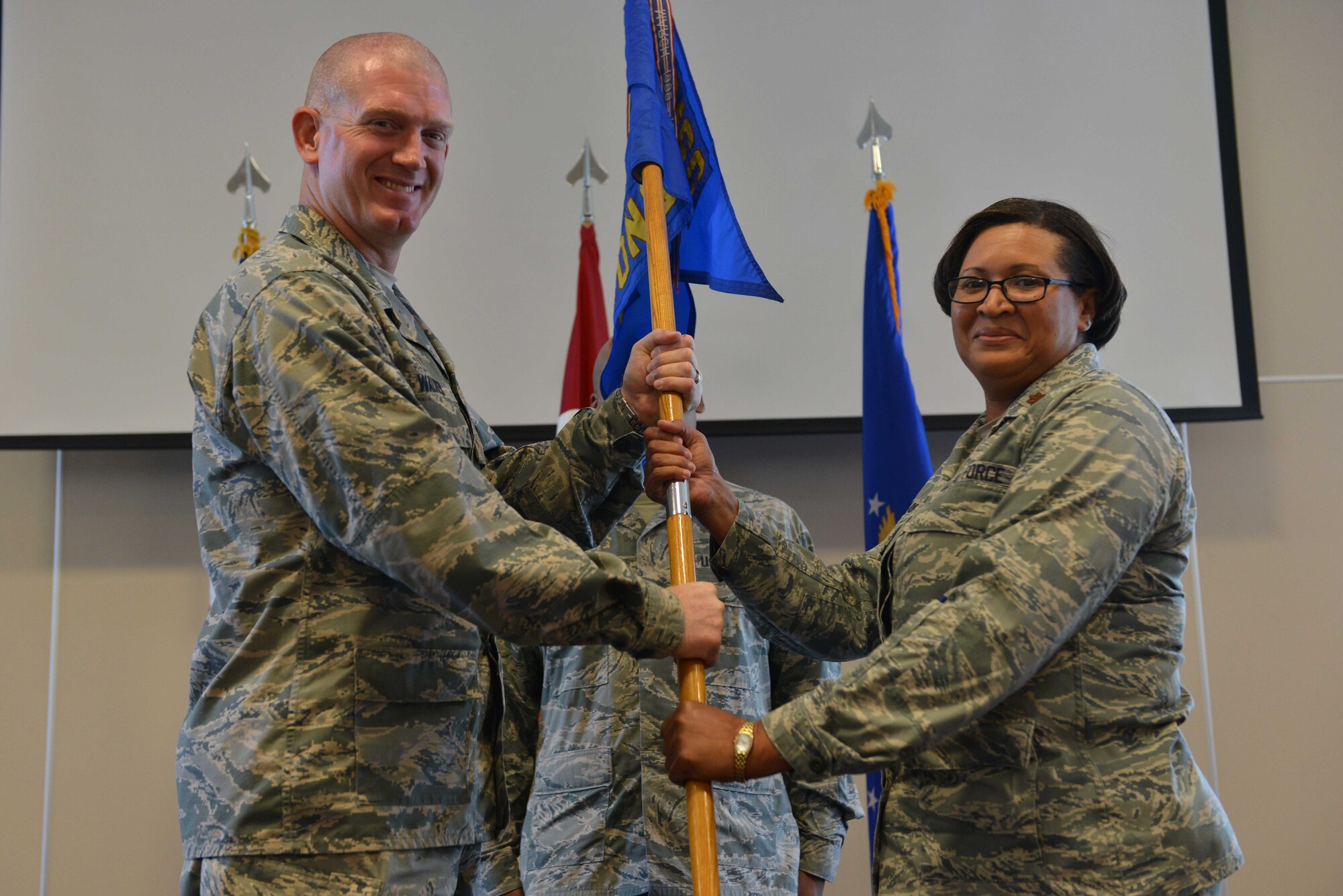 U.S. Air Force Maj. Yalunda Akinloba, 39th Contracting Squadron incoming commander, receives command from U.S. Air Force Col. John Walker, 39th Air Base Wing commander, June 13, 2016, at Incirlik Air Base, Turkey. Prior to taking command, Akinloba was the lead contracting officer, developmental systems contracts, rapid capabilities office, Headquarters U.S. Air Force, Washington D.C. (U.S. Air Force photo by Senior Airman John Nieves Camacho/Released) 