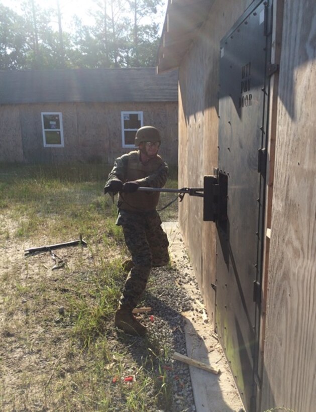 On June 3, 2016 Second Lieutenant Nicholas Downey, a Marine attached to Combat Engineer Officer course 5-16 (CEO 5-16); uses a hooligan tool to breach a door at Marine Corps Engineer School aboard Camp Lejeune, N.C. The hooligan tool is similar to a crowbar and provides the breacher with a high degree of versatility.
